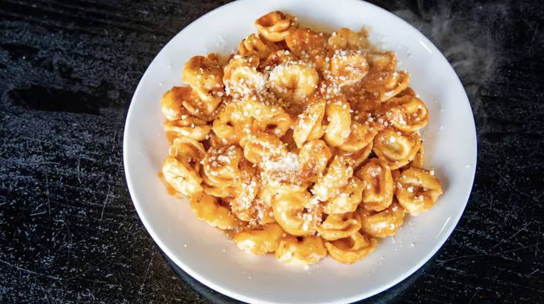 Order Cheese Tortellini with Tomato Cream Pasta (Cheese Tortellini with Crema di Pomodoro Pasta) food online from Comellas store, West Roxbury on bringmethat.com