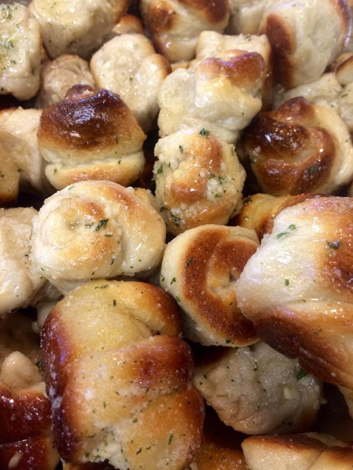 Order Garlic Knots with Sauce - 6 Pieces food online from Potsy Pizza store, Allentown on bringmethat.com