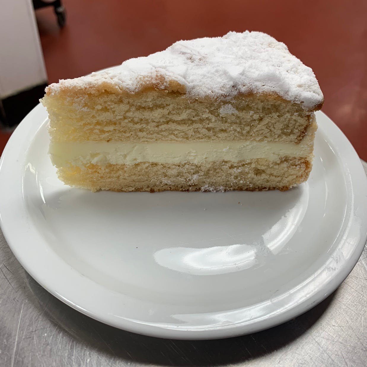 Order Italian Lemon Creme Cake - Dessert food online from Dolce To-Go store, Lake Havasu City on bringmethat.com