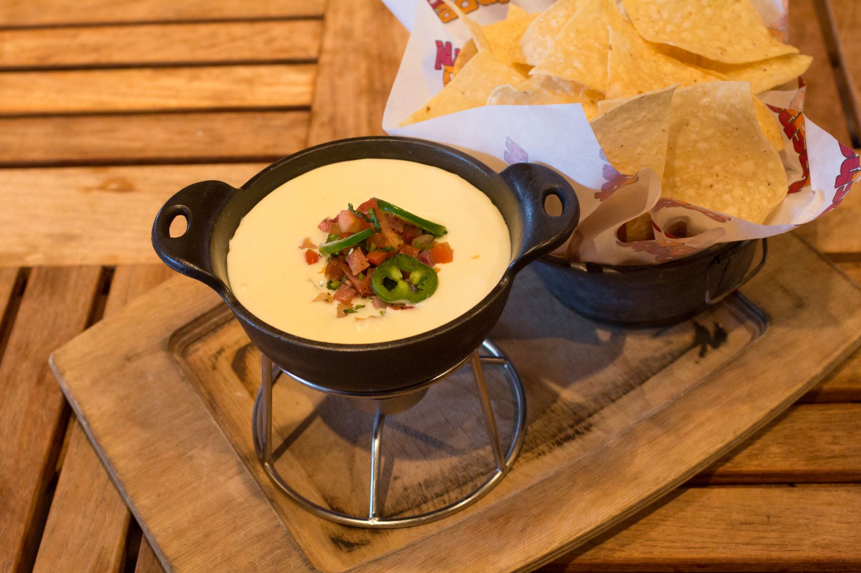Order Queso Dip food online from Nacho Daddy store, Las Vegas on bringmethat.com