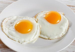 Order Fried Eggs (2) food online from Present Restaurant store, Falls Church on bringmethat.com