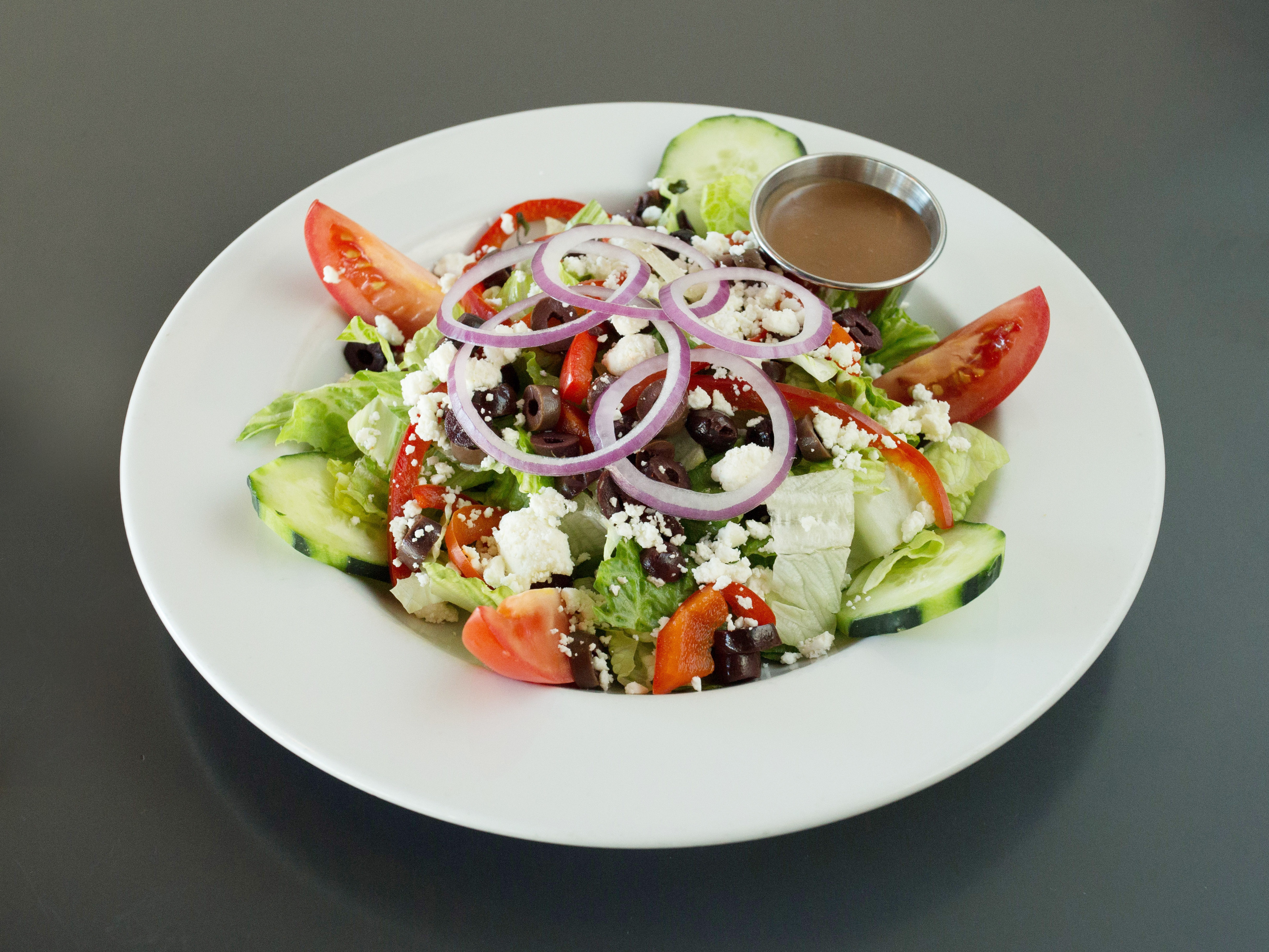 Order Greek Salad food online from Galaxy Cafe store, Austin on bringmethat.com
