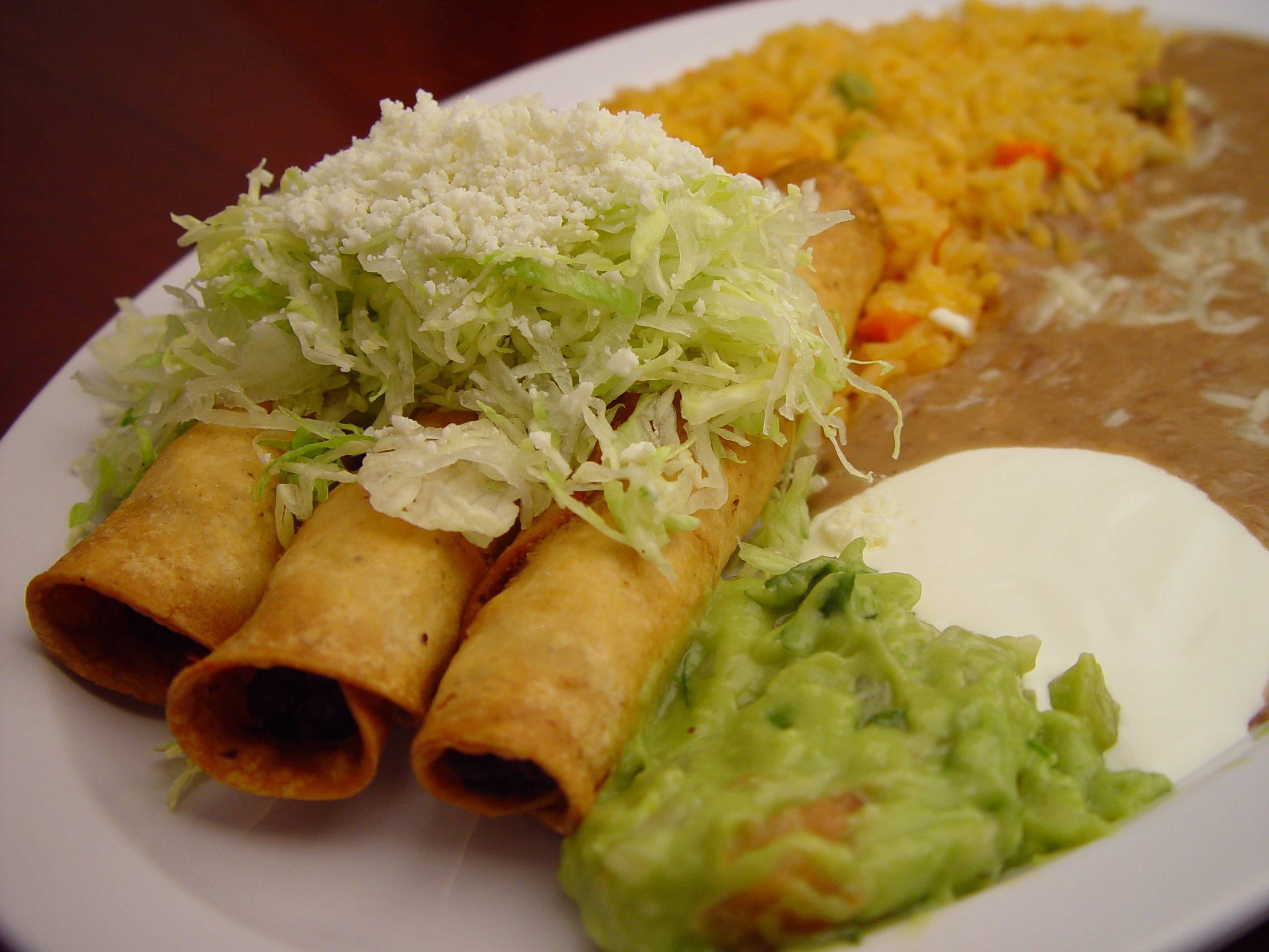 Order 43. Taquitos con Guacamole food online from Rodeo Mexican Grill store, Los Angeles on bringmethat.com