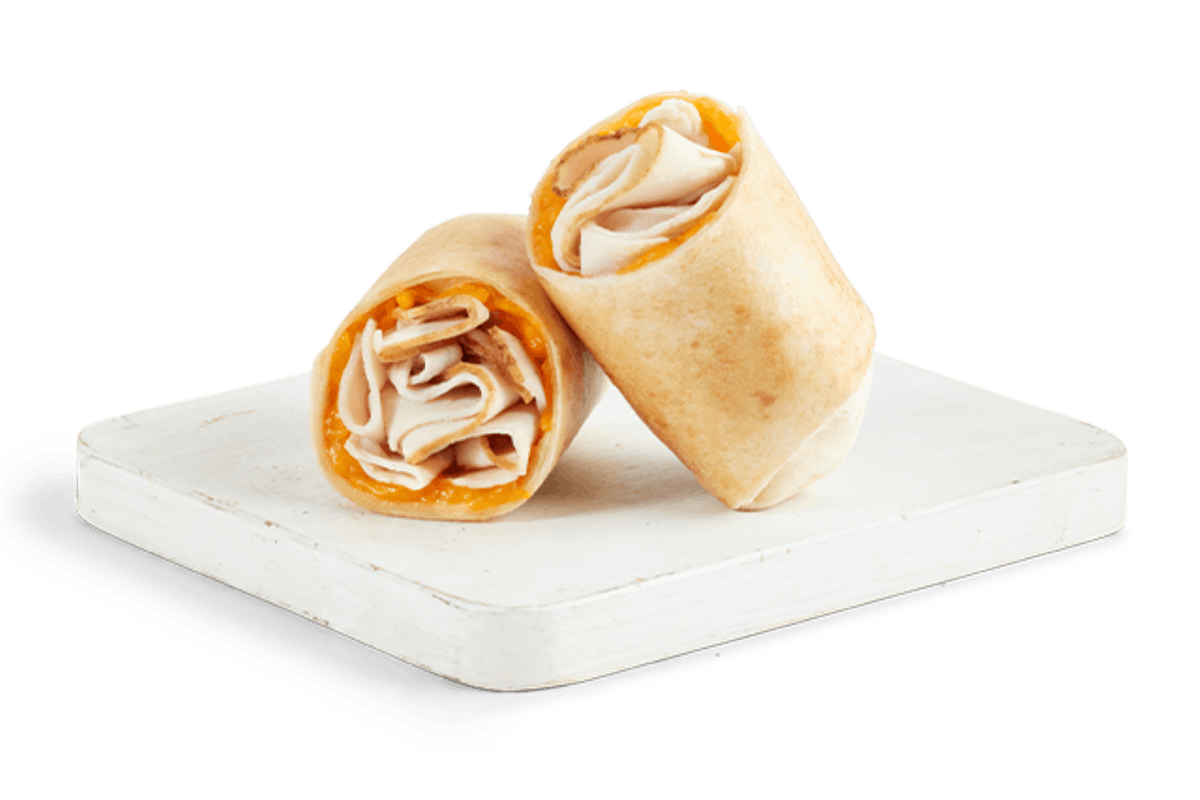 Order TURKEY & CHEDDAR WRAP food online from Tropical Smoothie Cafe store, Toledo on bringmethat.com