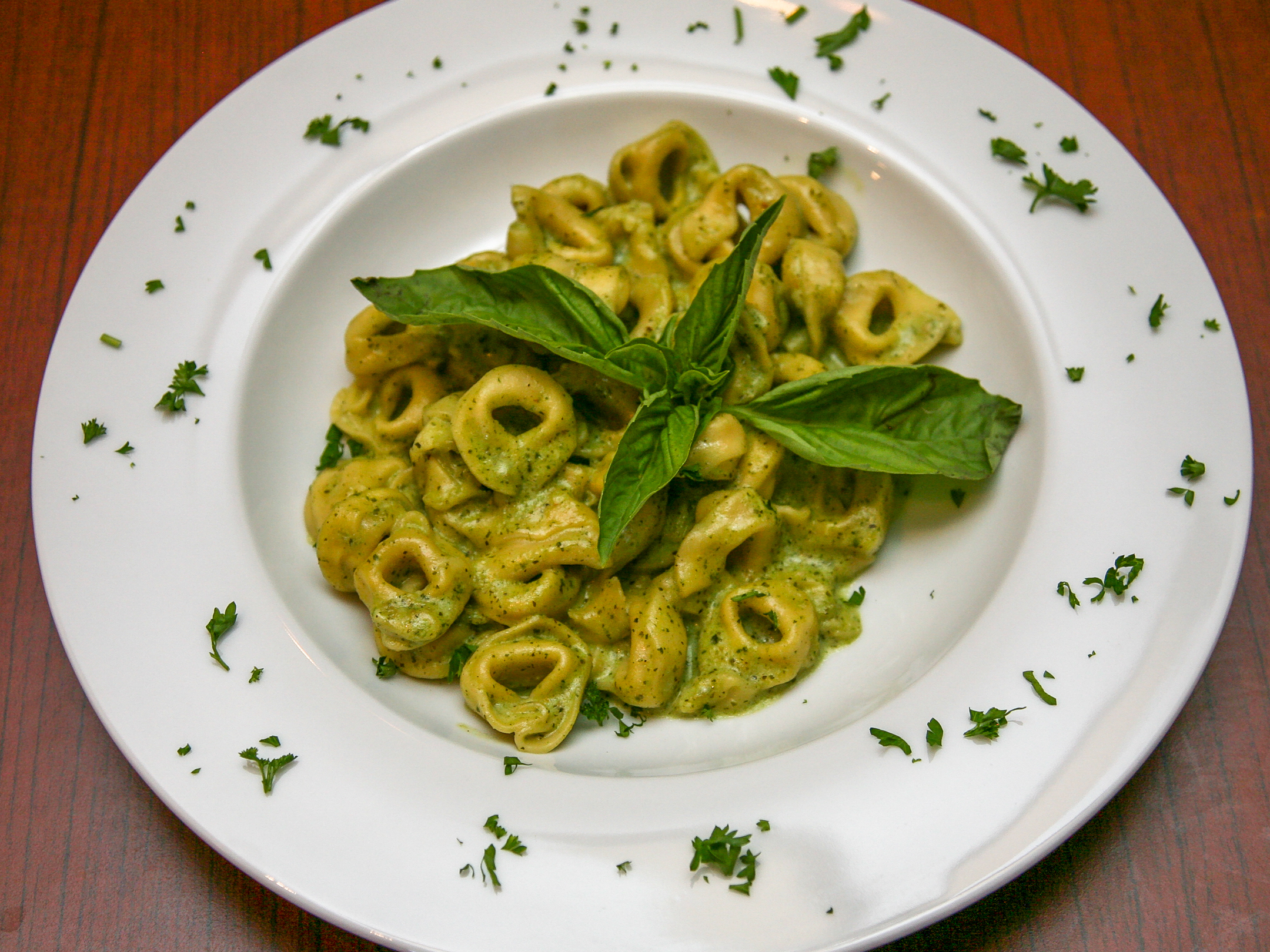 Order Tortellini al Pesto food online from Venetos Cucina Italiana store, Oceanside on bringmethat.com