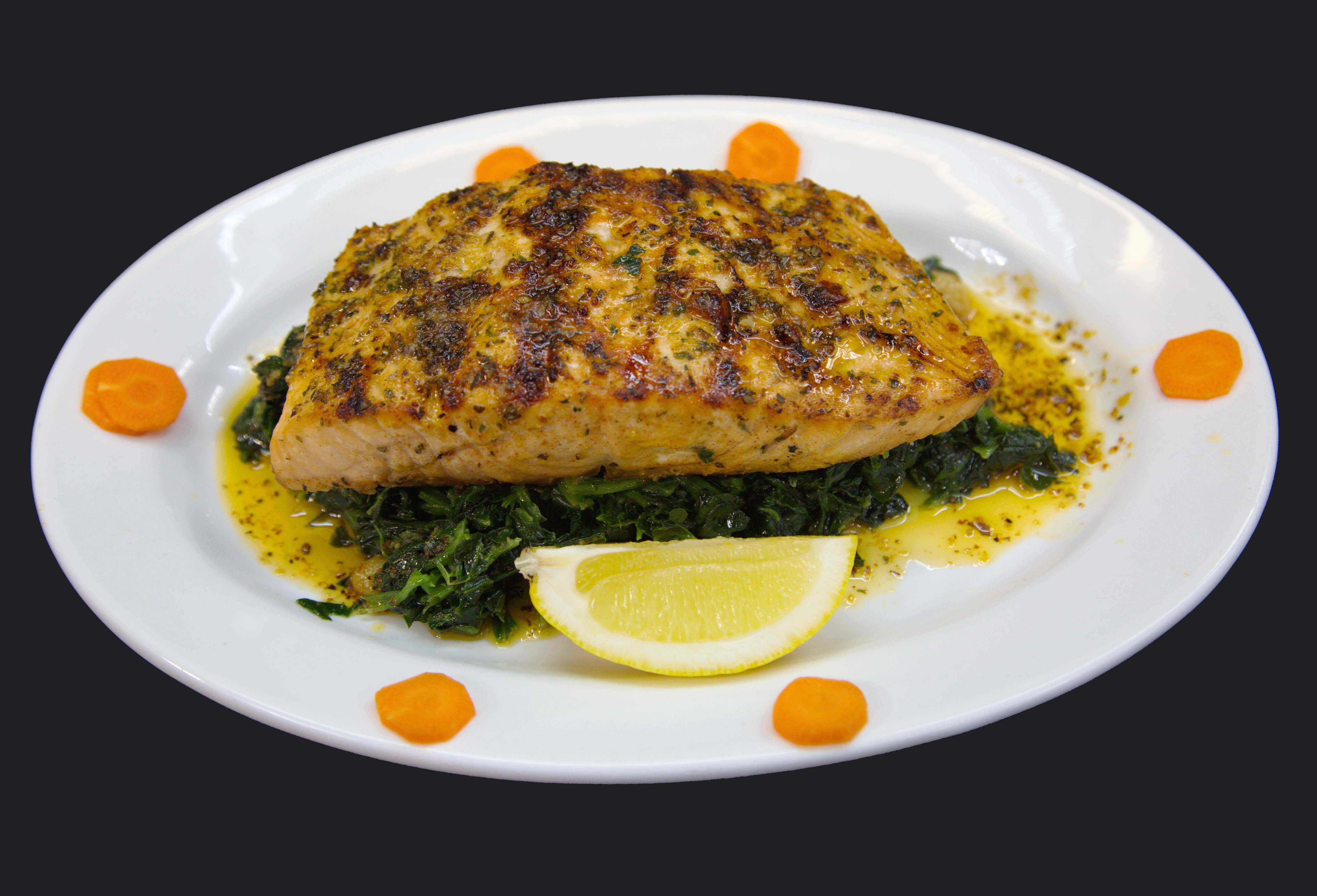 Order Grilled Salmon over Spinach food online from Famous Calabria store, New York on bringmethat.com