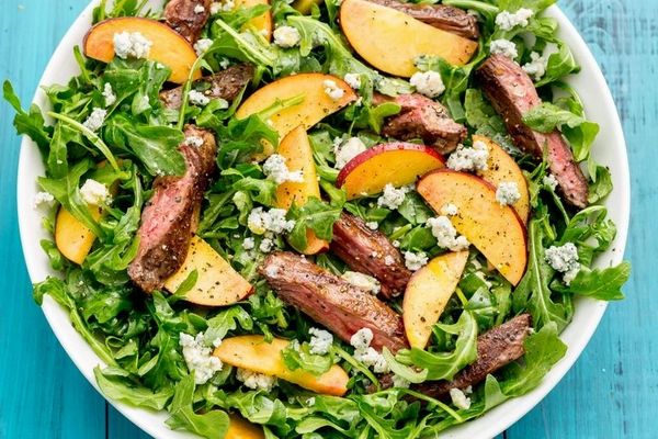 Order Balsamic Steak and Arugula Salad with Peaches Entree food online from The Spice Of Life Catering store, Carrollton on bringmethat.com