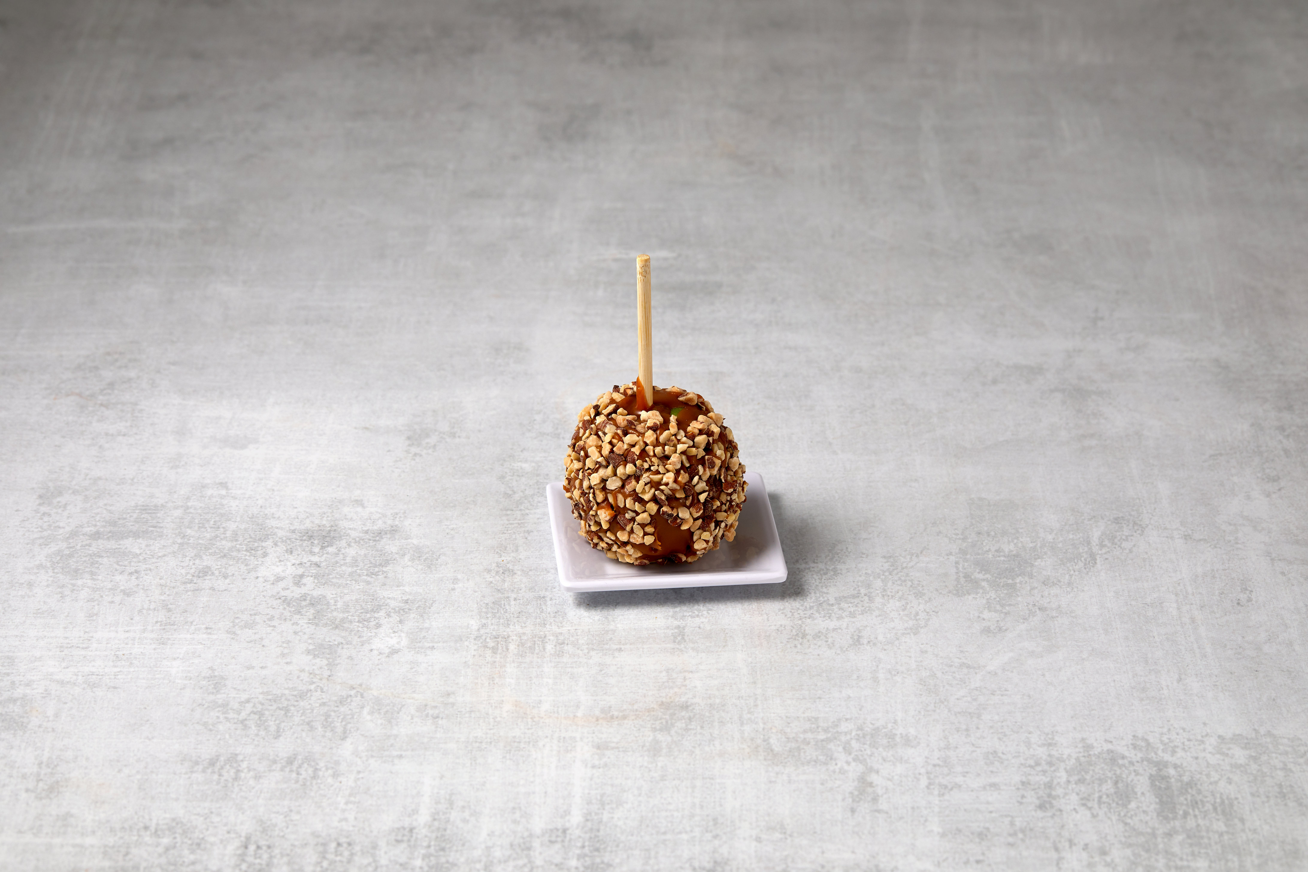 Order Almond Caramel Apple food online from Rocky Mountain Chocolate Factory store, Irvine on bringmethat.com