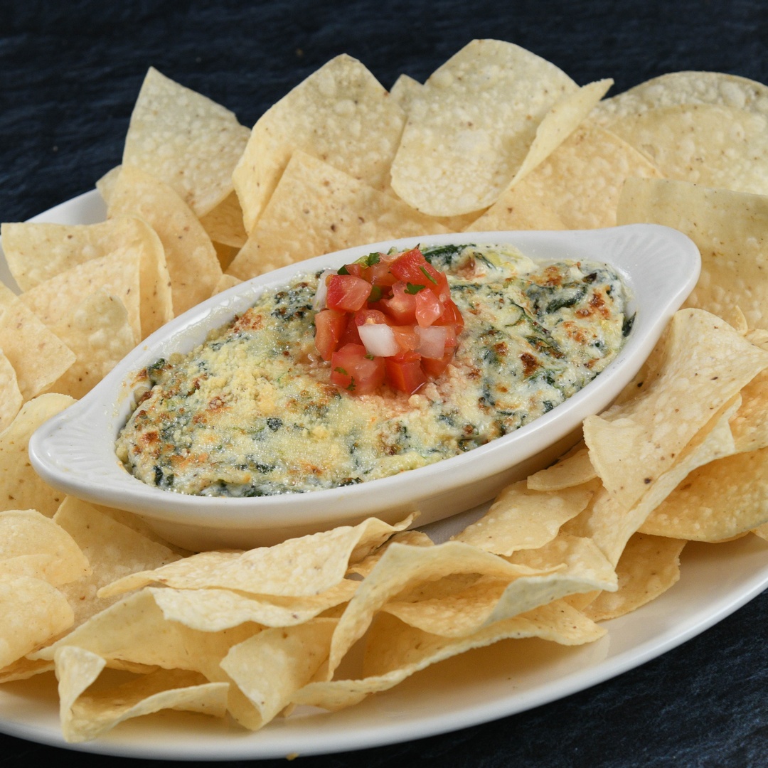 Order Spinach & Artichoke Dip* food online from Rainforest Cafe store, Las Vegas on bringmethat.com