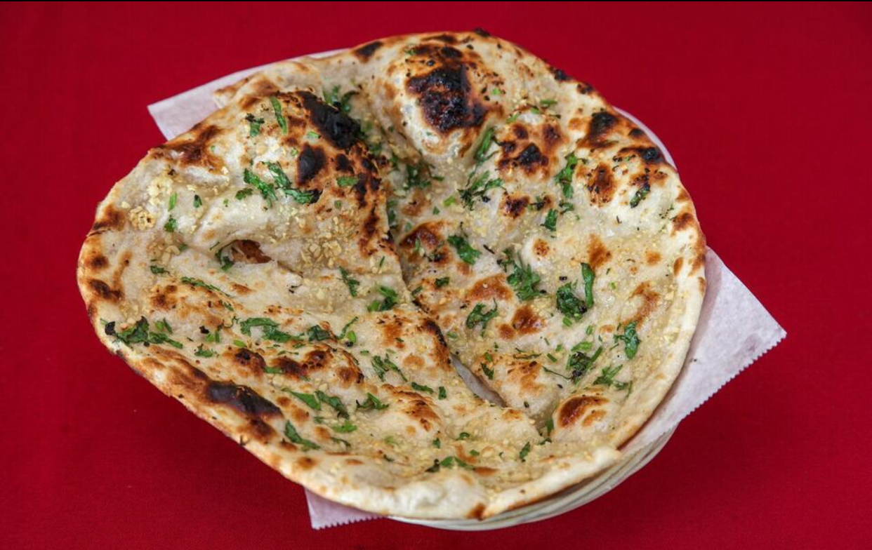 Order Garlic Naan food online from Great Indian Cuisine store, Santa Clara on bringmethat.com