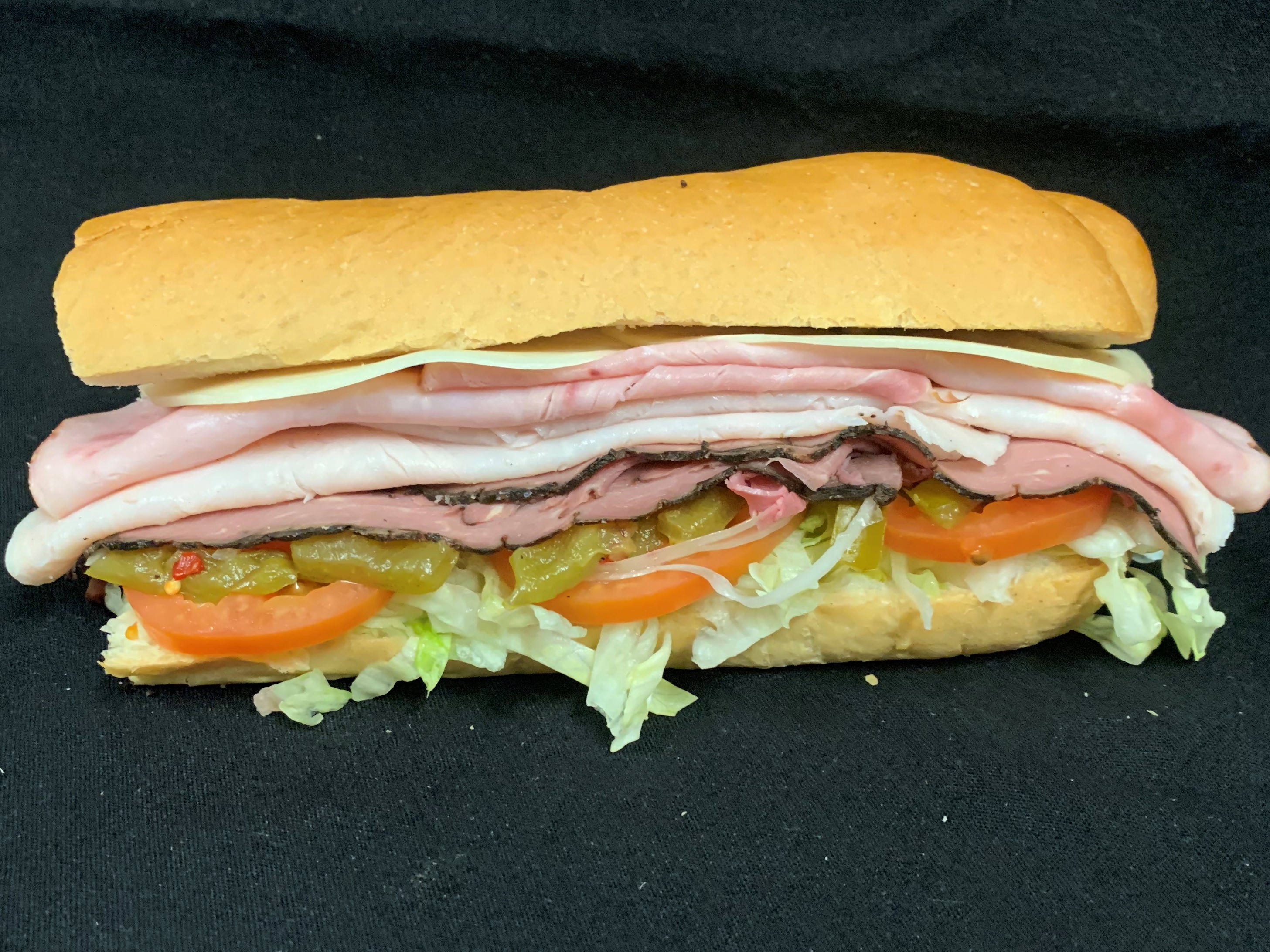 Order 15. Ham, Turkey, Roast Beef and Cheese Sub food online from Tony Subs & Pizza store, Inglewood on bringmethat.com