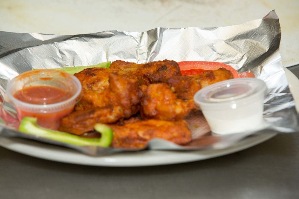 Order Hot Buffalo Wings - 8 Pieces food online from Milanos Pizza store, Seven Points on bringmethat.com