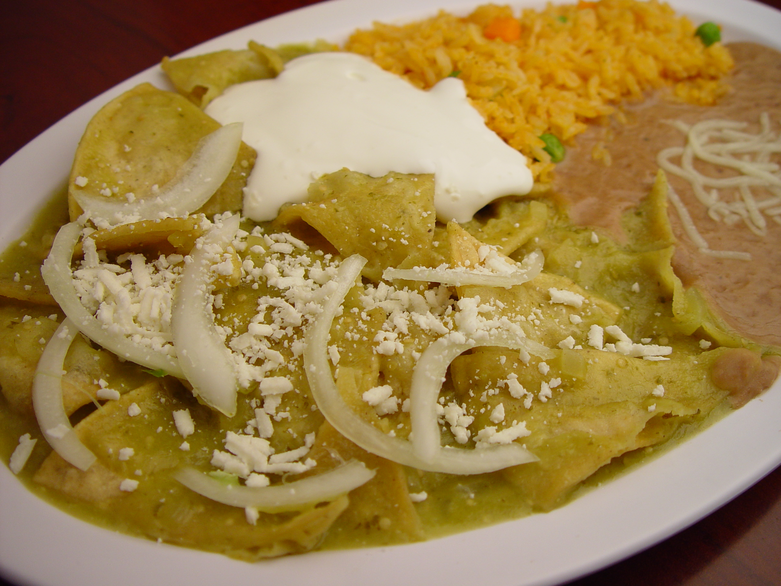 Order 16. Green Chilaquiles con Huevo food online from Rodeo Mexican Grill store, Los Angeles on bringmethat.com