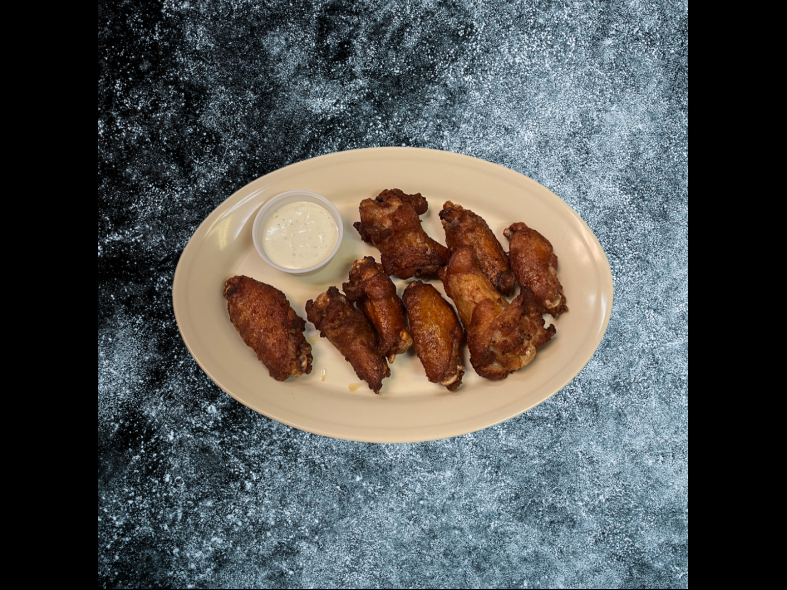 Order 50 Wings* food online from The Slice Pizzeria store, San Antonio on bringmethat.com