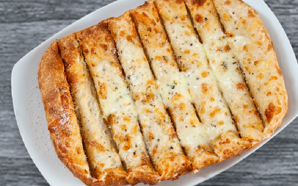 Order Cheezy Breadsticks - Appetizer food online from Seasons Pizza store, Wilmington on bringmethat.com