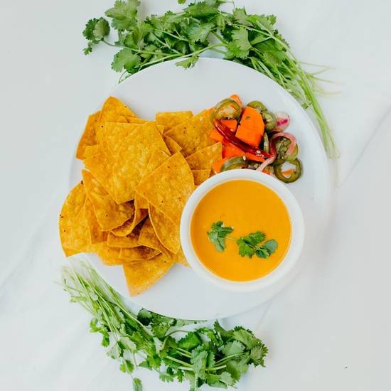 Order Plant Based Queso w chips food online from Chicas Tacos-Aw store, Los Angeles on bringmethat.com
