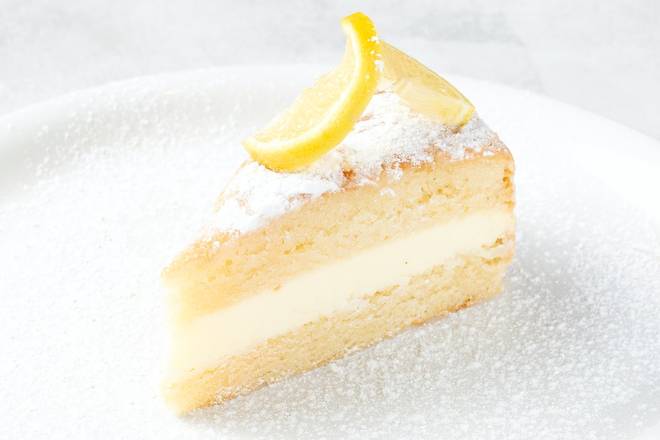 Order LEMON CREAM CAKE food online from Johnny Carino's store, Sioux Falls on bringmethat.com
