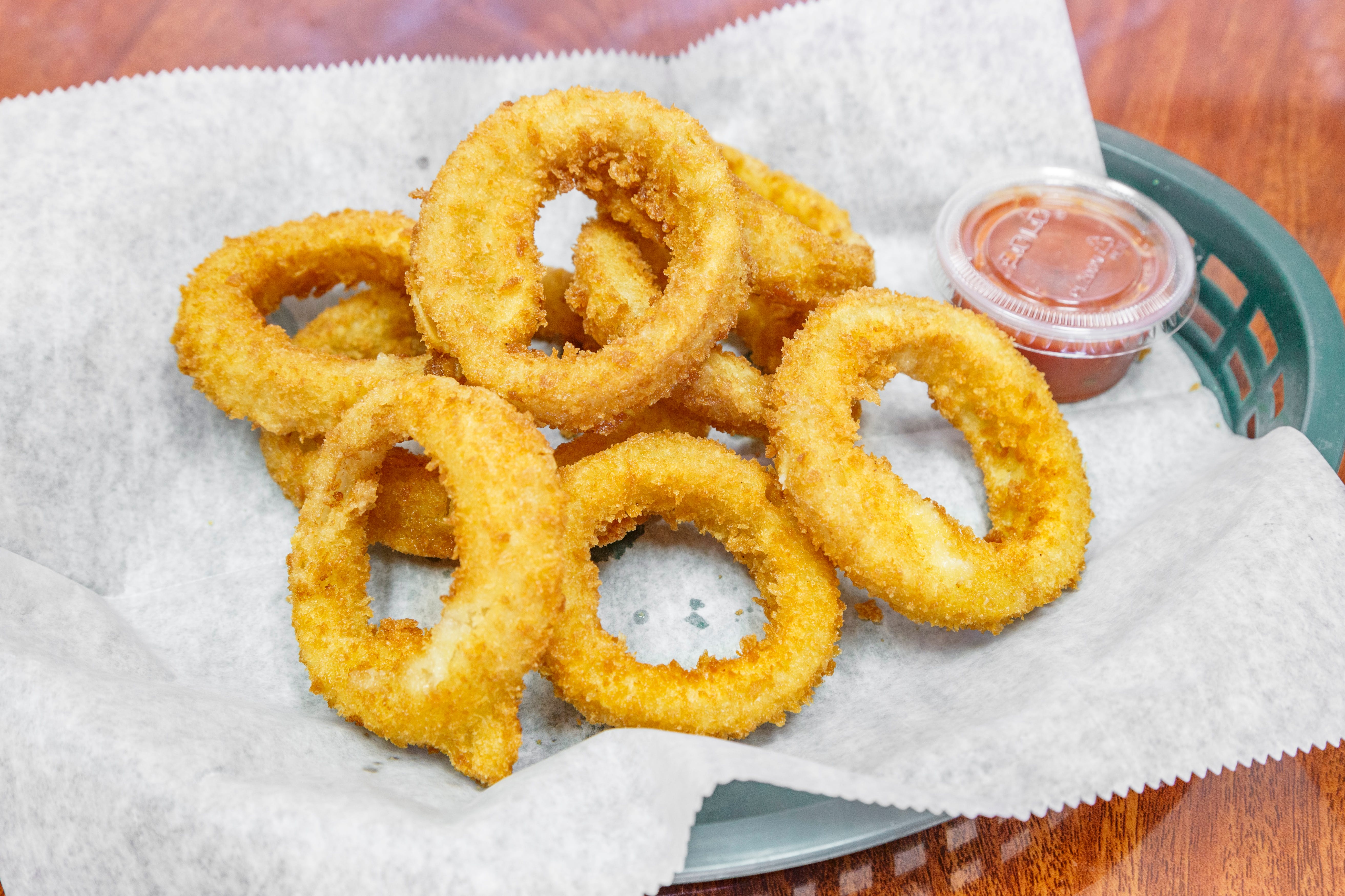 Order Onion Rings - 10 Pieces food online from Peppercini Italian Restaurant & Lounge store, Mc Kees Rocks on bringmethat.com