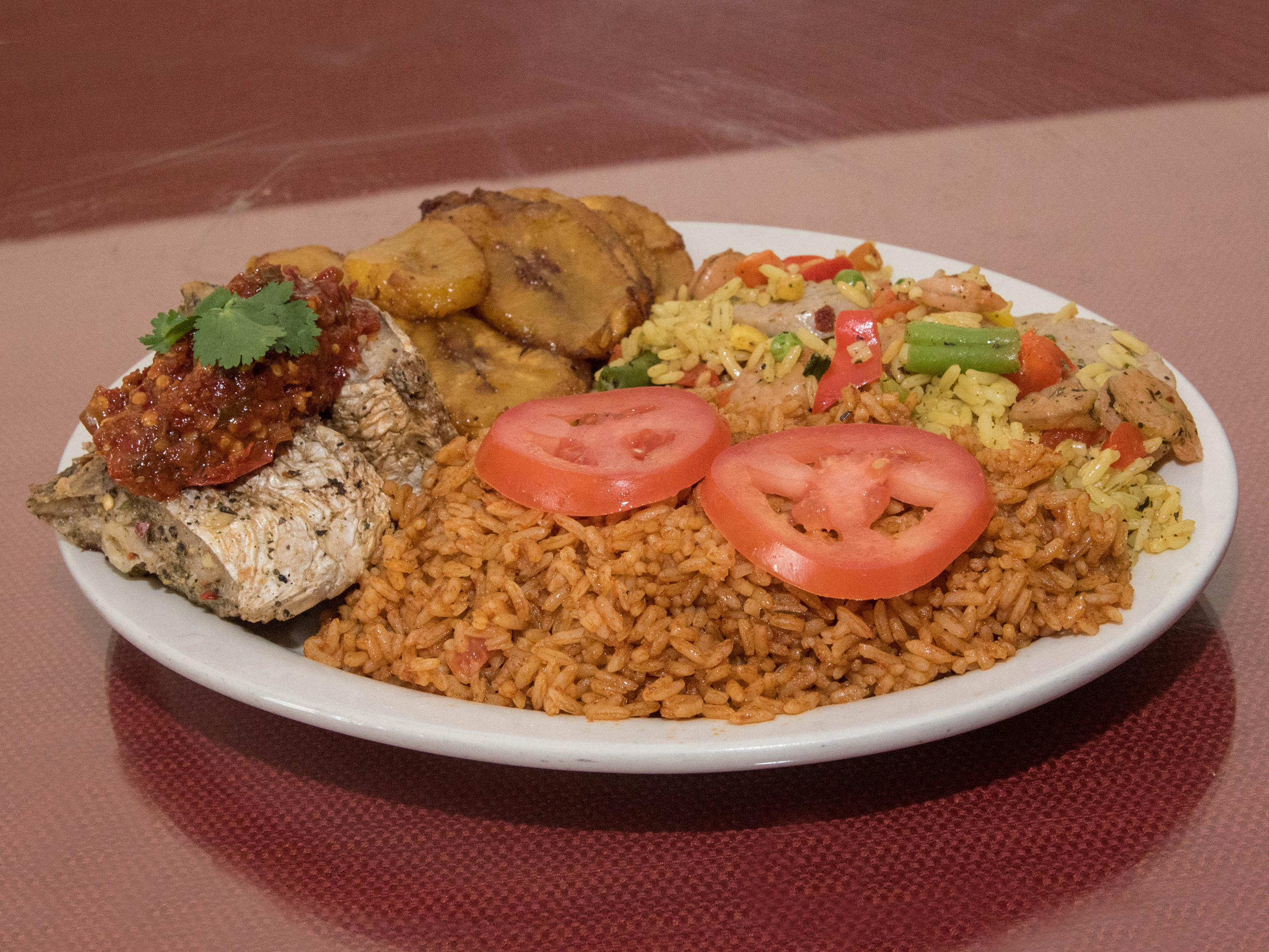 Order Jollof Rice and Protein food online from Kalakutah Republic Grill store, Indianapolis on bringmethat.com