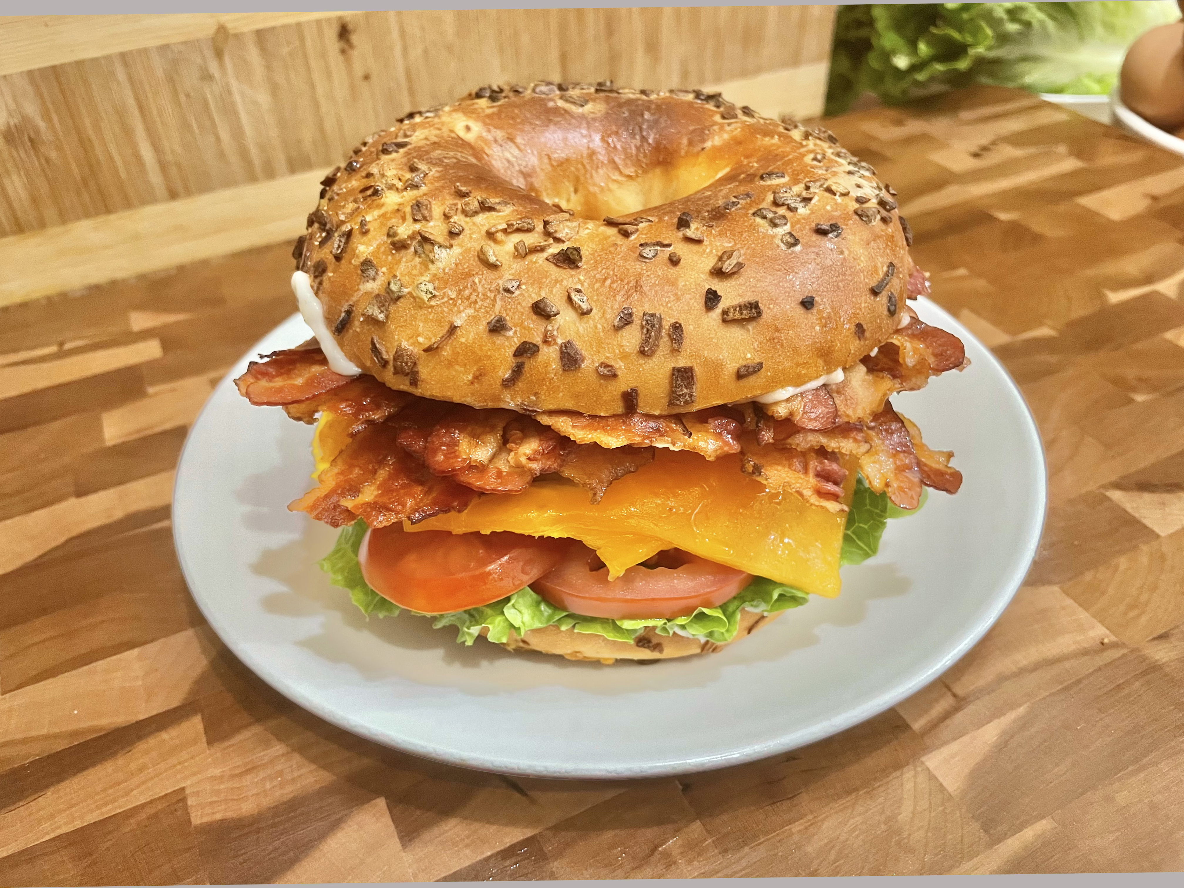 Order Bagel with Mayo, Lettuce, Tomato, Egg, Cheese and Bacon food online from Glaze Donuts And Bagel Sandwiches store, San Francisco on bringmethat.com