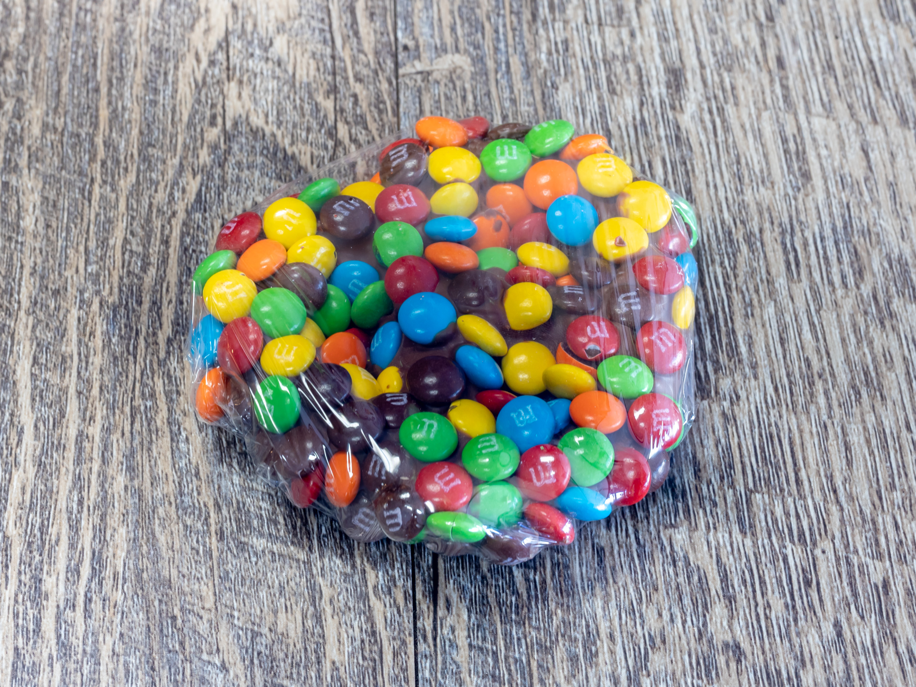 Order Dipped Pretzel -M&M food online from Rocky Mountain Chocolate Factory store, Houston on bringmethat.com