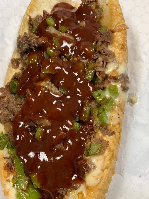 Order Mumbo Philly Cheesesteak with (9oz of meat on a  Amoroso roll) peppers onions and a generous amount of Mumbo sauce food online from From Philly To Charlit store, Charlotte on bringmethat.com