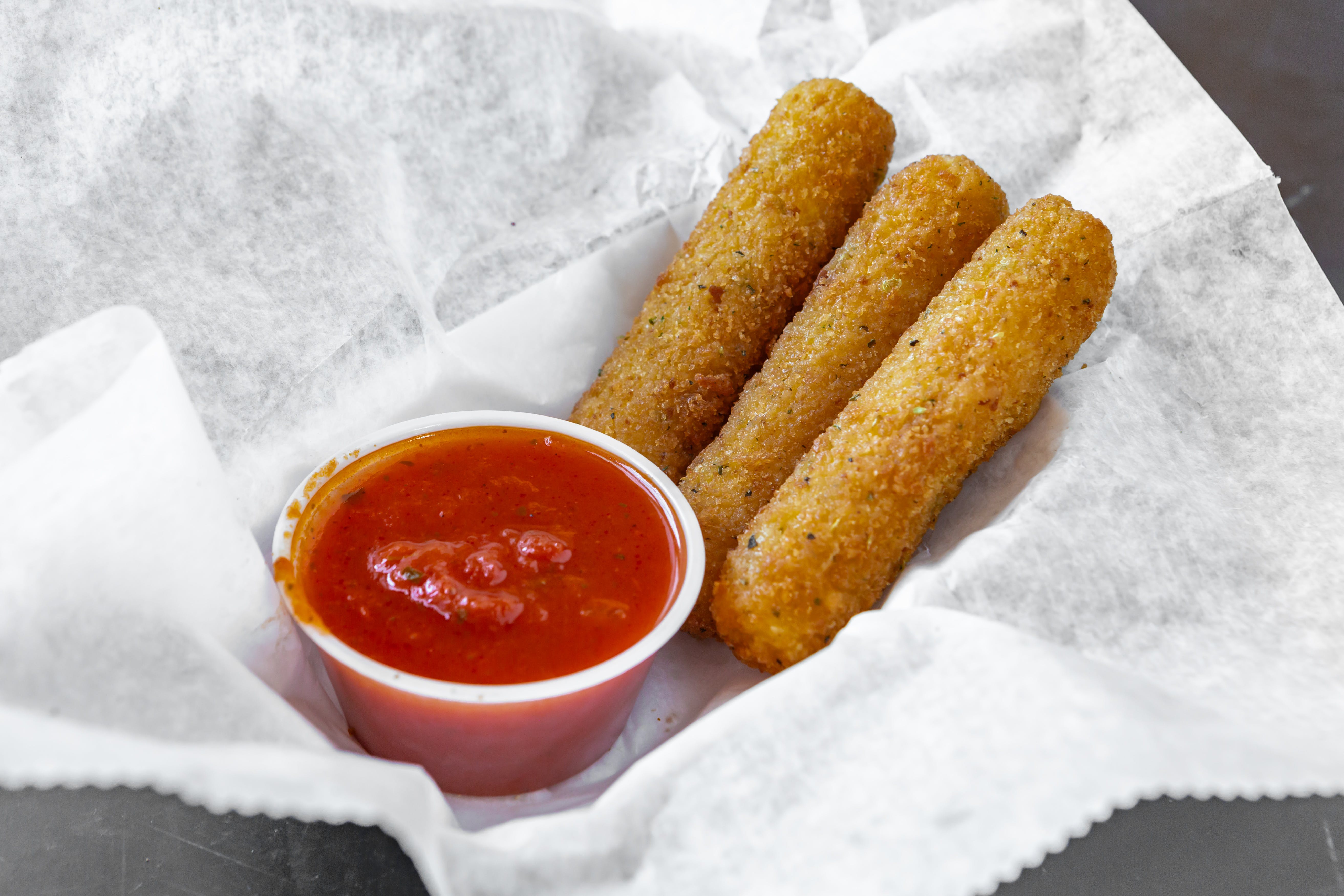 Order Mozzarella Sticks - Small (7 Pieces) food online from Pizza By Rocco store, Natick on bringmethat.com