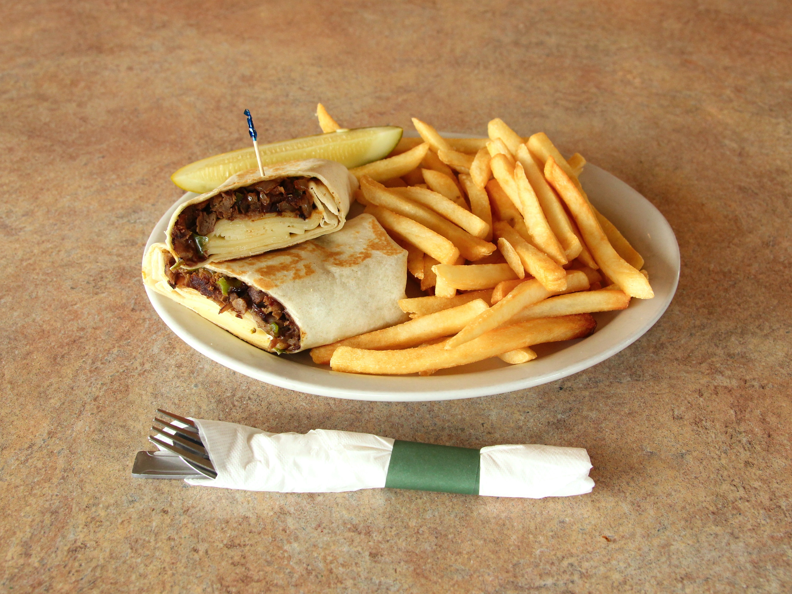 Order Philly Cheese Steak Wrap food online from Ram Horn Restaurant store, Taylor on bringmethat.com