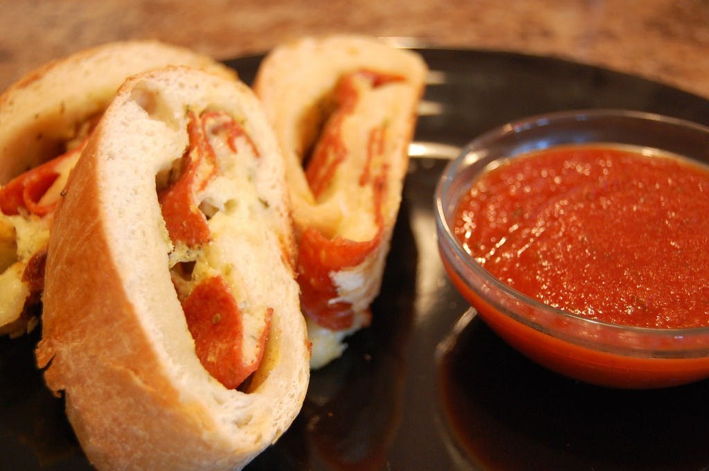 Order Sausage Stromboli - Small food online from House Of Pizza store, Pennsauken Township on bringmethat.com