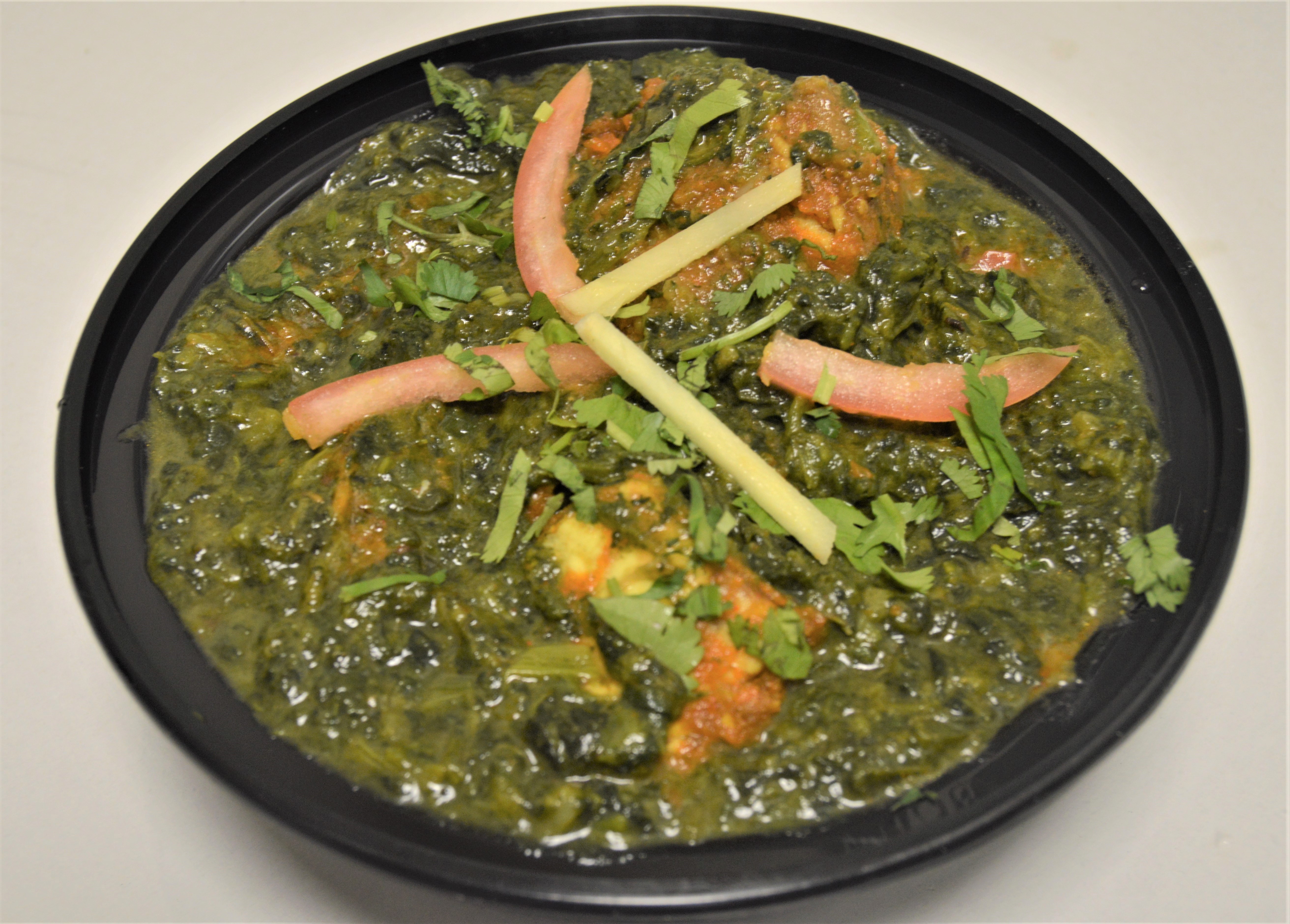 Order 40. Goat Spinach food online from Salt And Pepper Grill Iii store, Washington on bringmethat.com