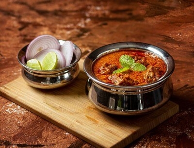 Order Andhra Goat Curry food online from Peacock Indian Cuisine store, Plano on bringmethat.com