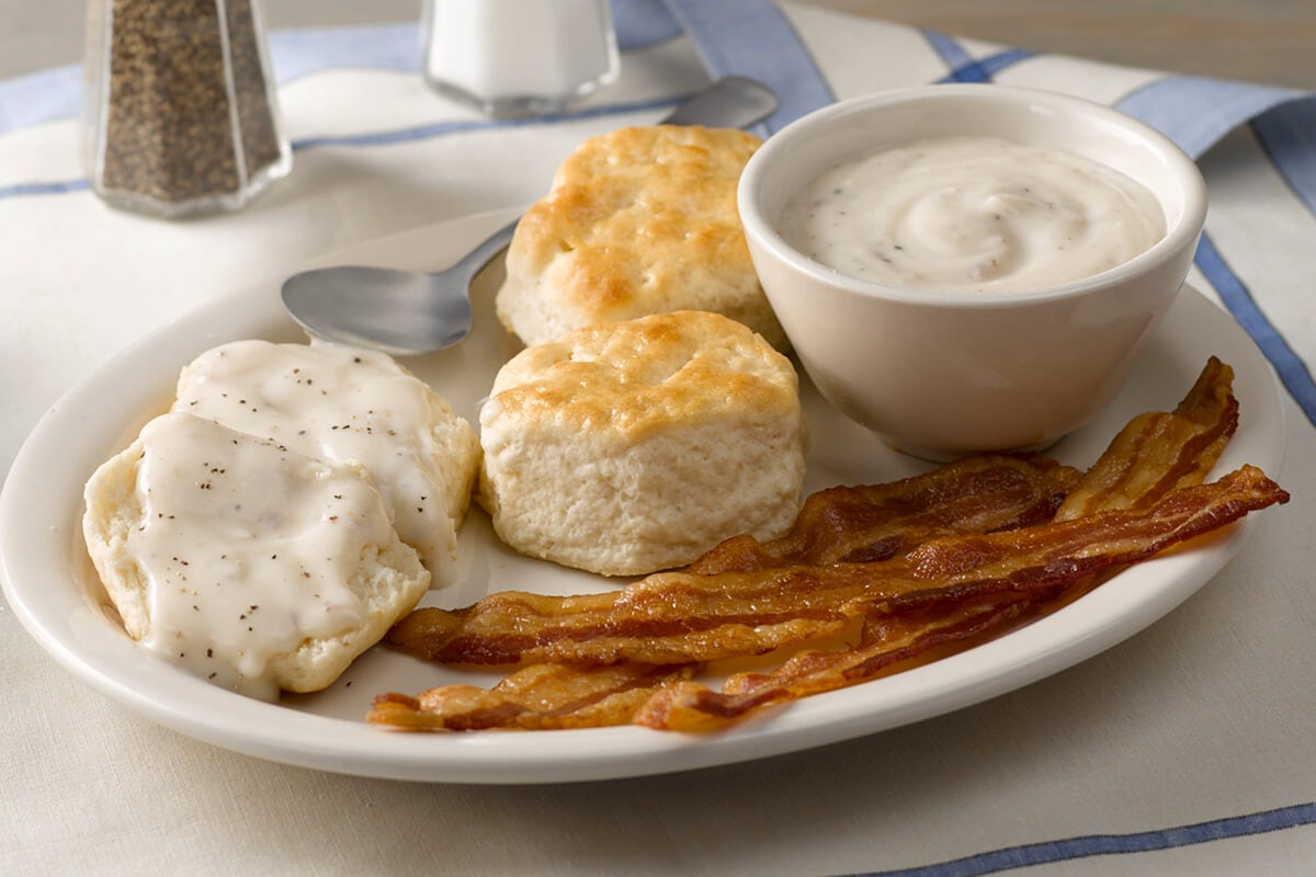 Order Biscuits n' Gravy with Bacon or Sausage food online from Cracker Barrel Old Country Store store, Adairsville on bringmethat.com