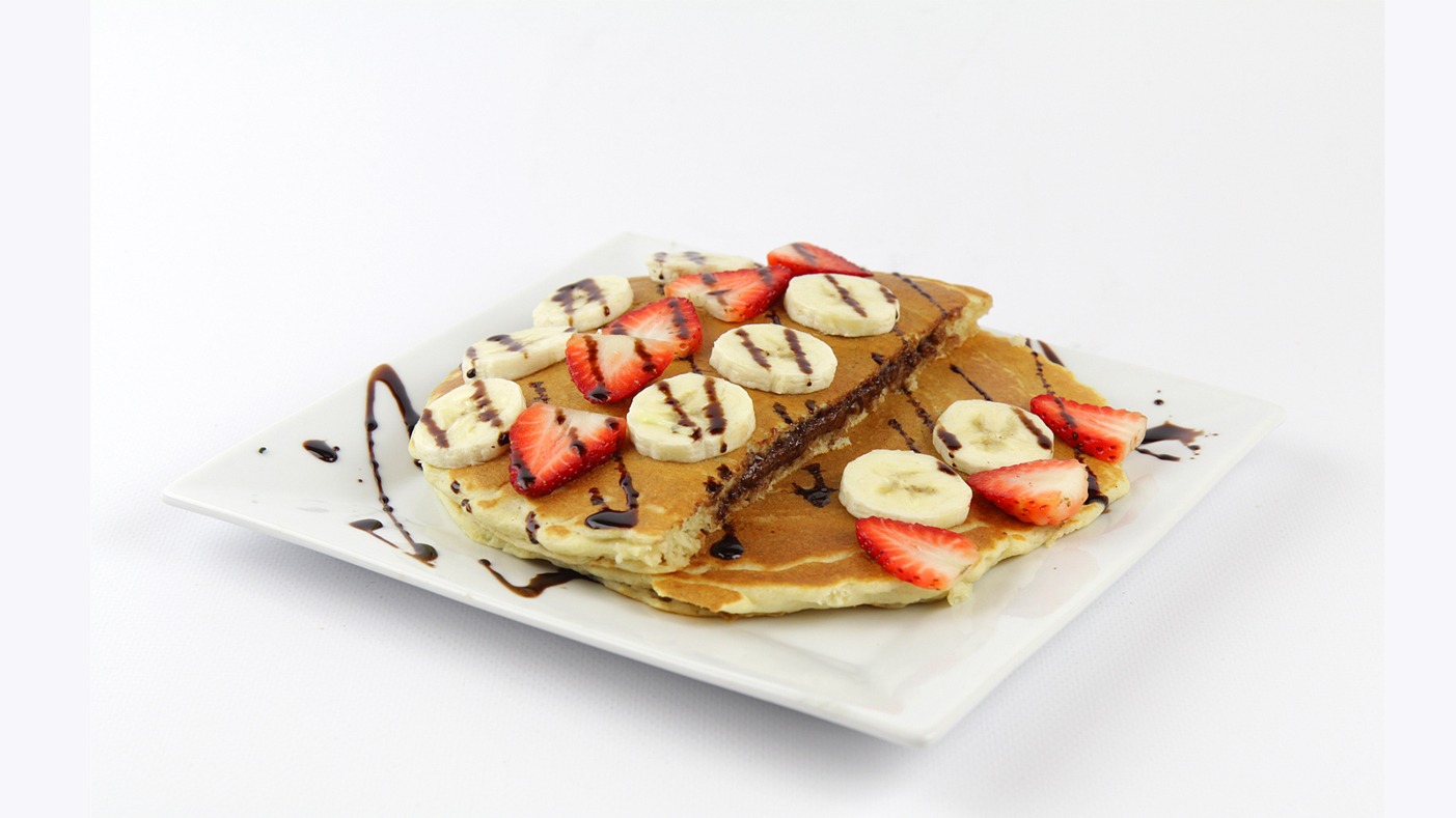 Order Strawberry Banana Stuffed Nutella Pancakes food online from Matty's Grill & Pancake House store, Shorewood on bringmethat.com