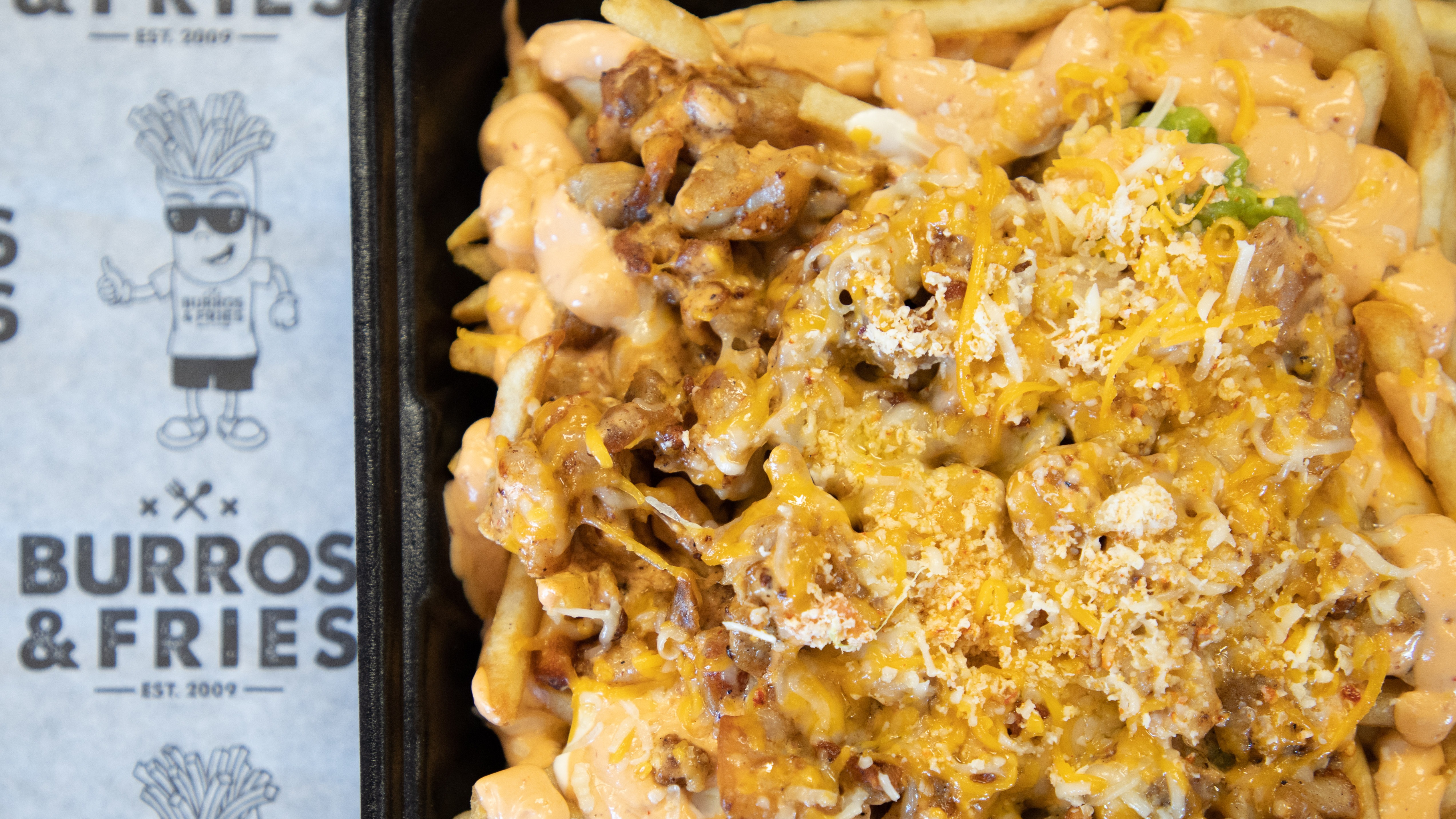 Order * Chipotle Fries food online from Burros & Fries store, Chula Vista on bringmethat.com