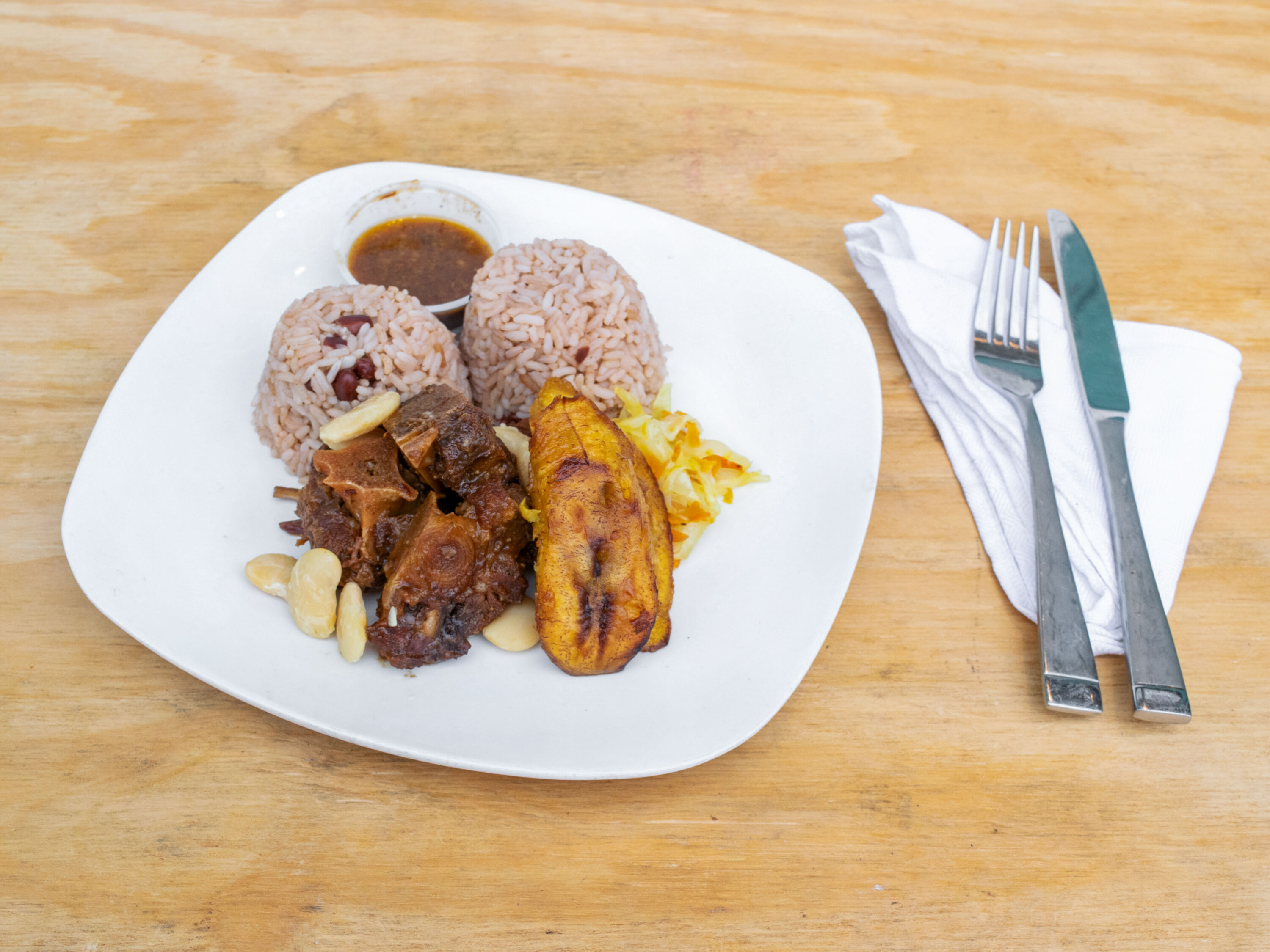 Order Oxtail Meal food online from Grand Mango Caribbean Catering store, Woodbury on bringmethat.com