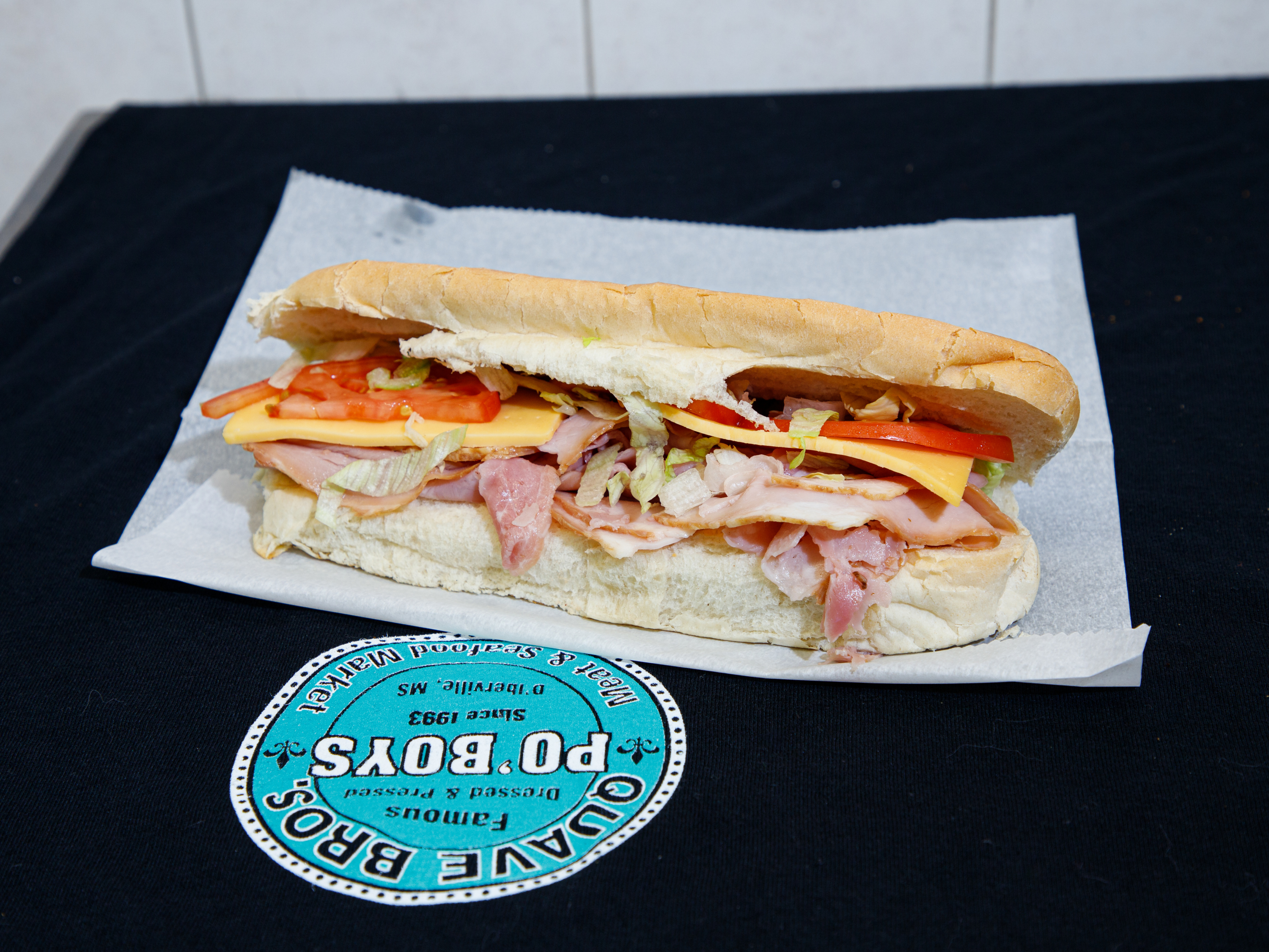 Order 16" Ham NOLA Style Po'Boy food online from Quave Brothers Poboys and Meat Market store, Diberville on bringmethat.com