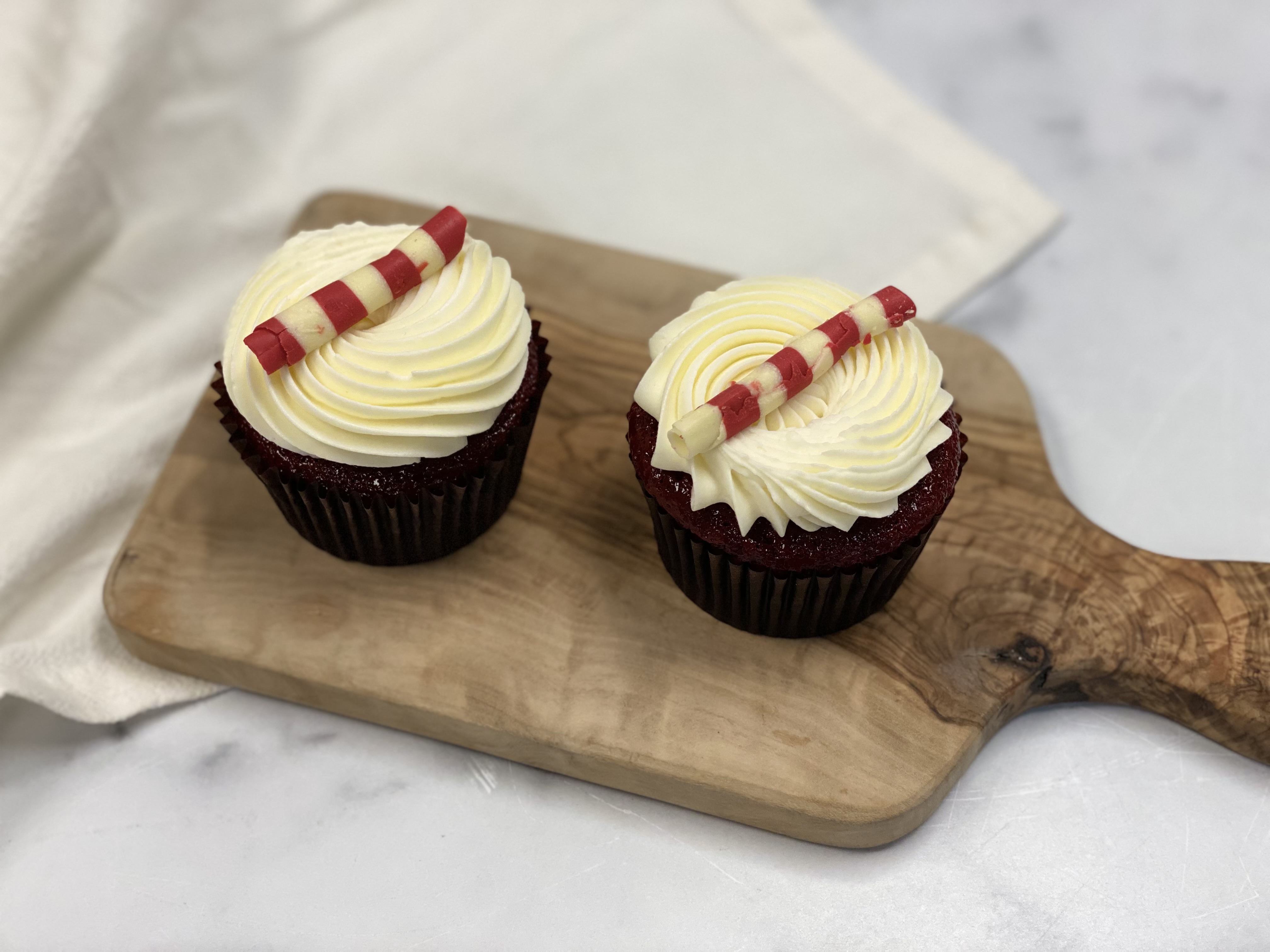 Order Set of 2 Red Velvet Cupcake food online from 43 & Company store, Milpitas on bringmethat.com