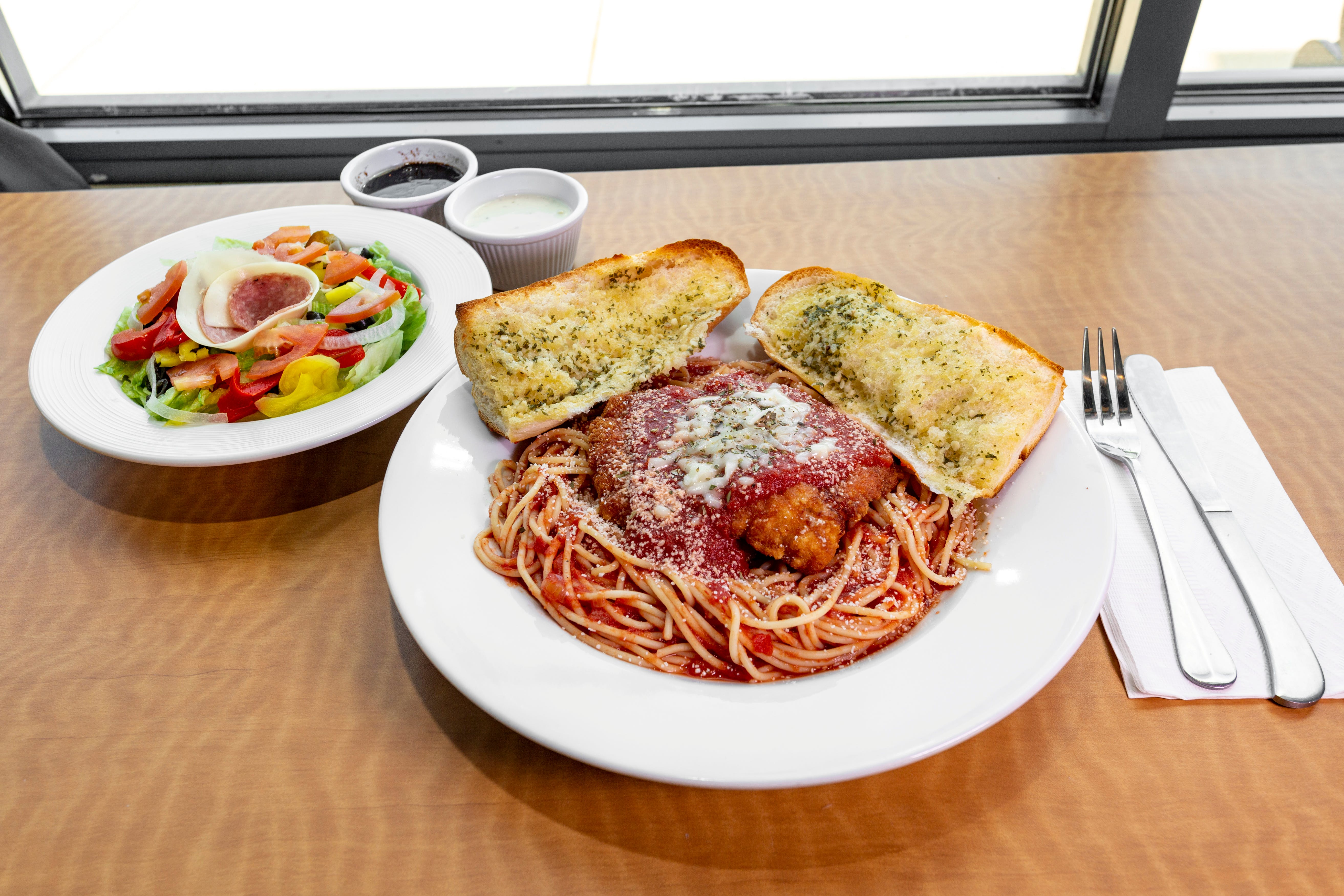 Order Chicken Parmigiana - Entree food online from Mario Cafe & Pizzeria store, East Greenville on bringmethat.com