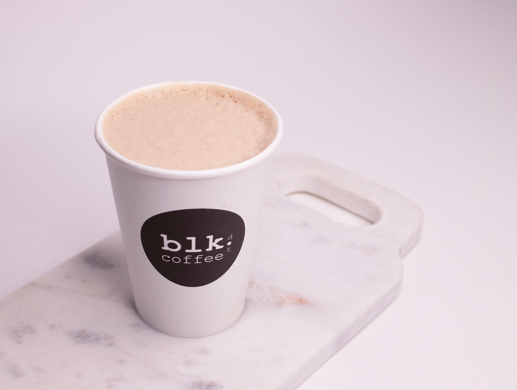 Order Hot Milk Tea Latte food online from Blk Dot Coffee store, Irvine on bringmethat.com