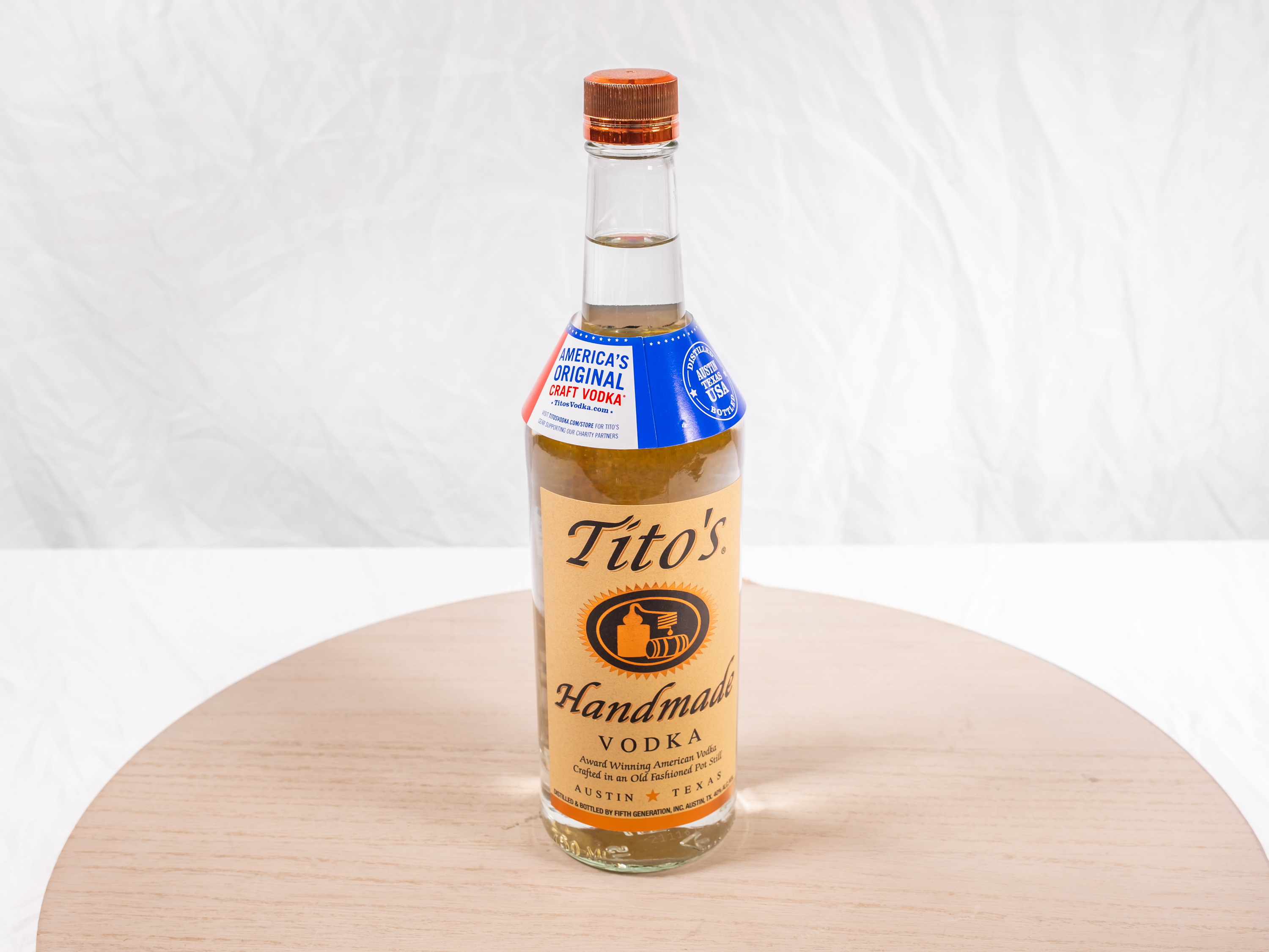 Order 750 ml. Tito's Vodka food online from M & G Market store, Highland on bringmethat.com