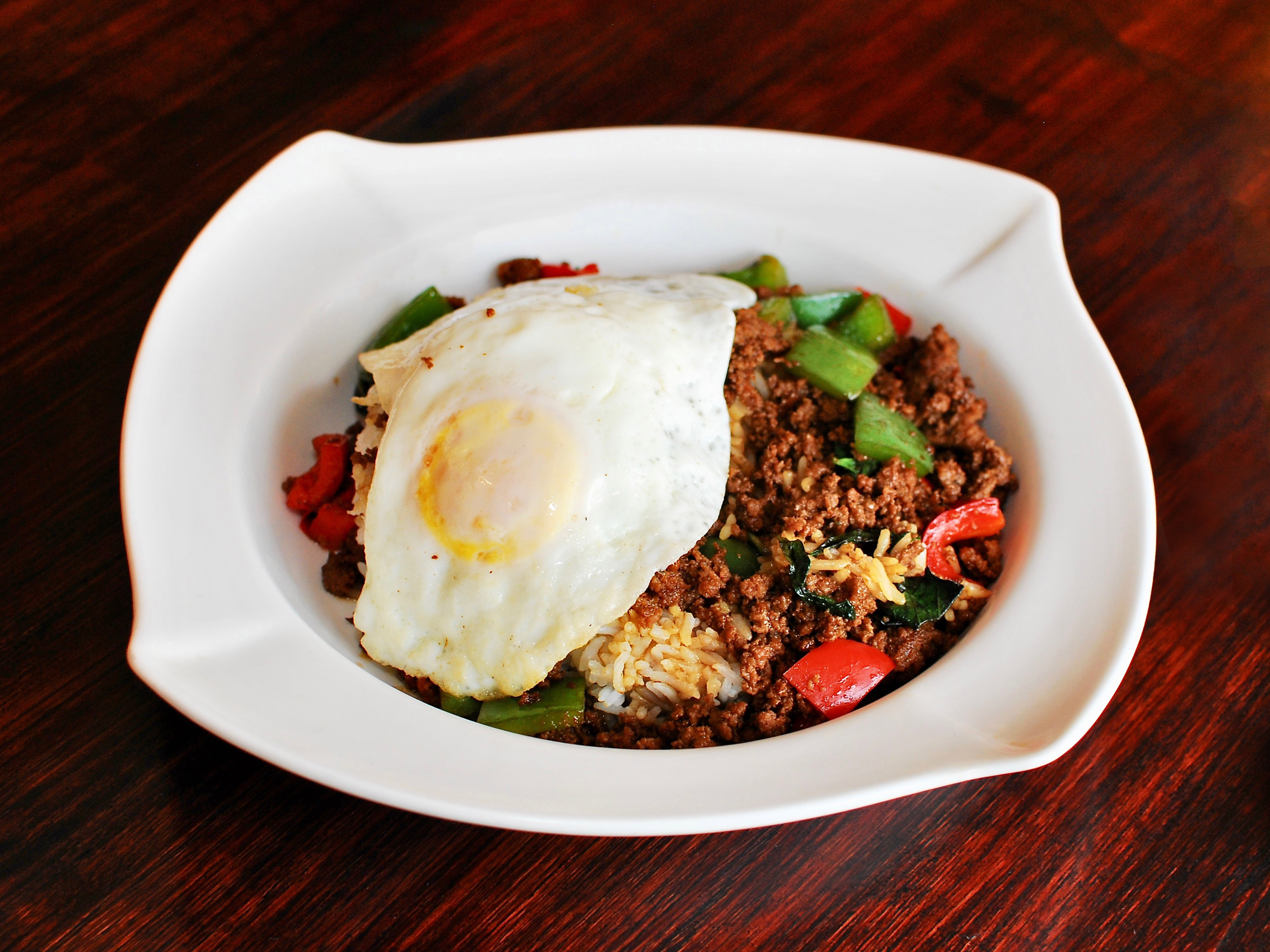 Order 1. Basil with Meat over Rice with Fried Egg food online from Sticky Rice store, Chicago on bringmethat.com