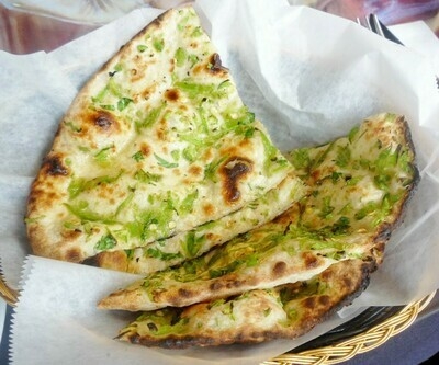 Order Green Chilli Cilantro Naan food online from Peacock Indian Cuisine store, Plano on bringmethat.com