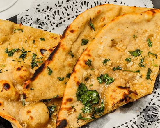 Order Naan food online from Nirvana Indian Cuisine store, New Orleans on bringmethat.com
