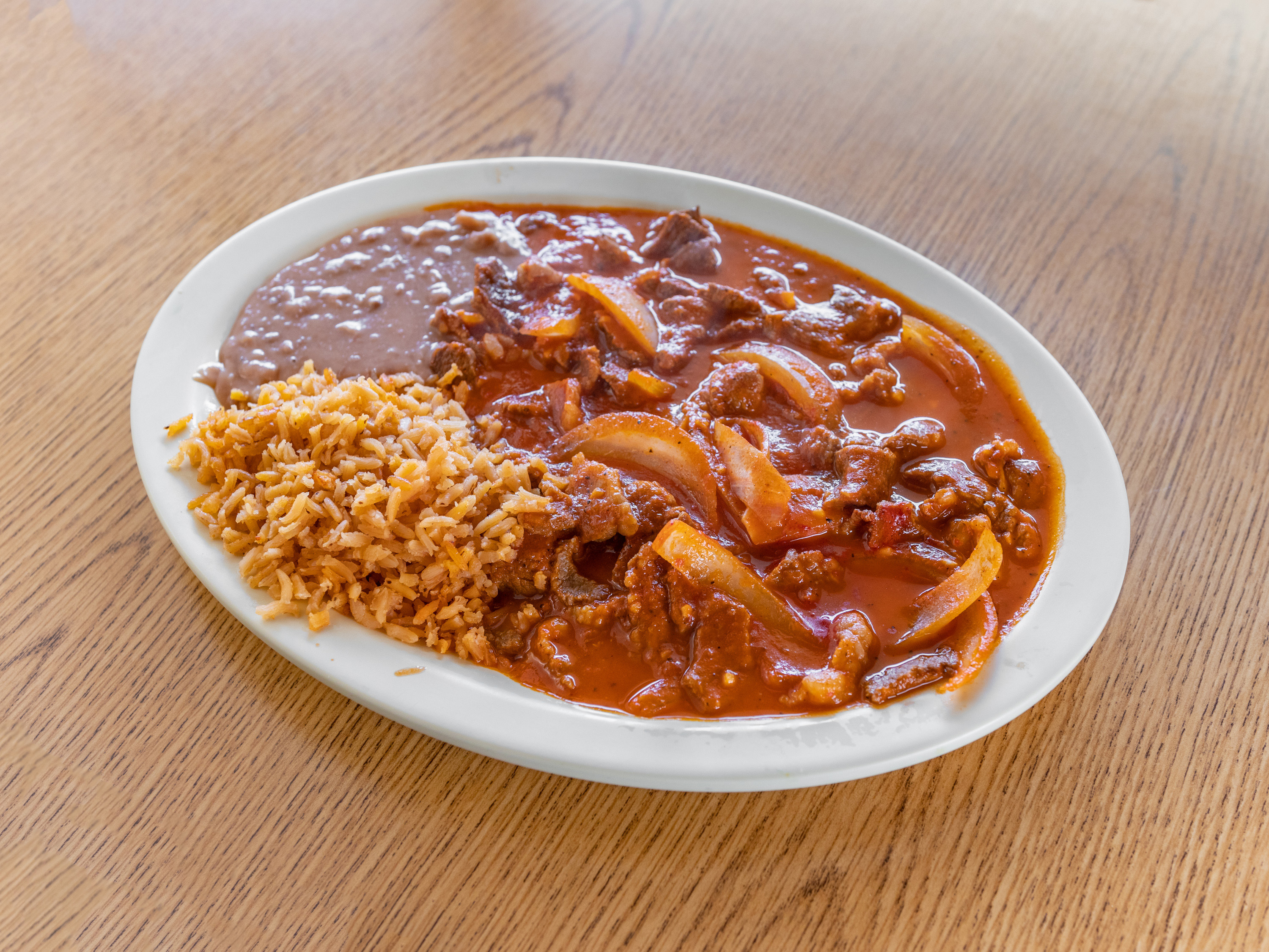 Order Bistec Ranchero Dinner food online from Taqueria Los Compadres store, Omaha on bringmethat.com