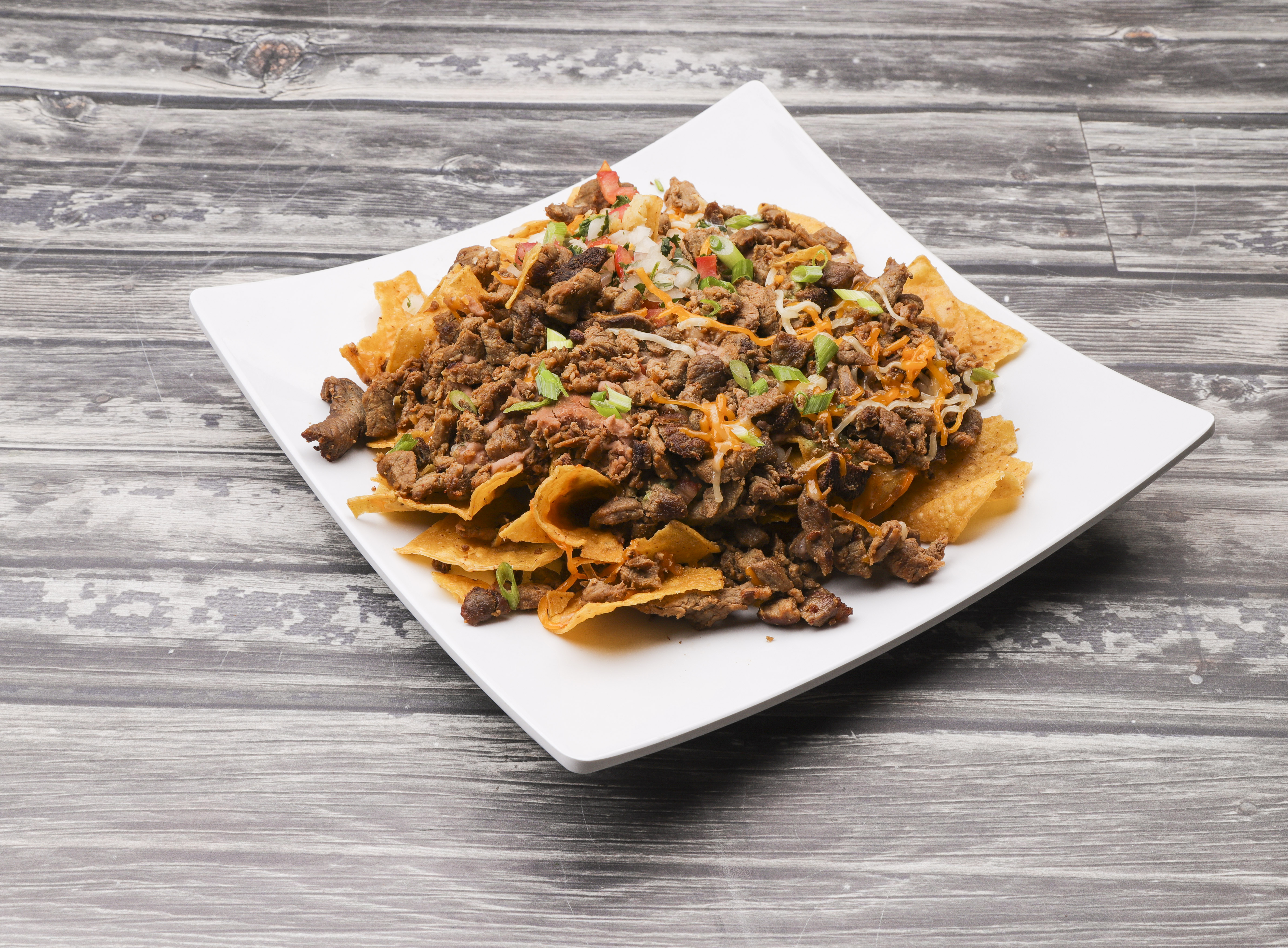 Order Super Nachos food online from D'leon Taco Rico store, Lincoln on bringmethat.com