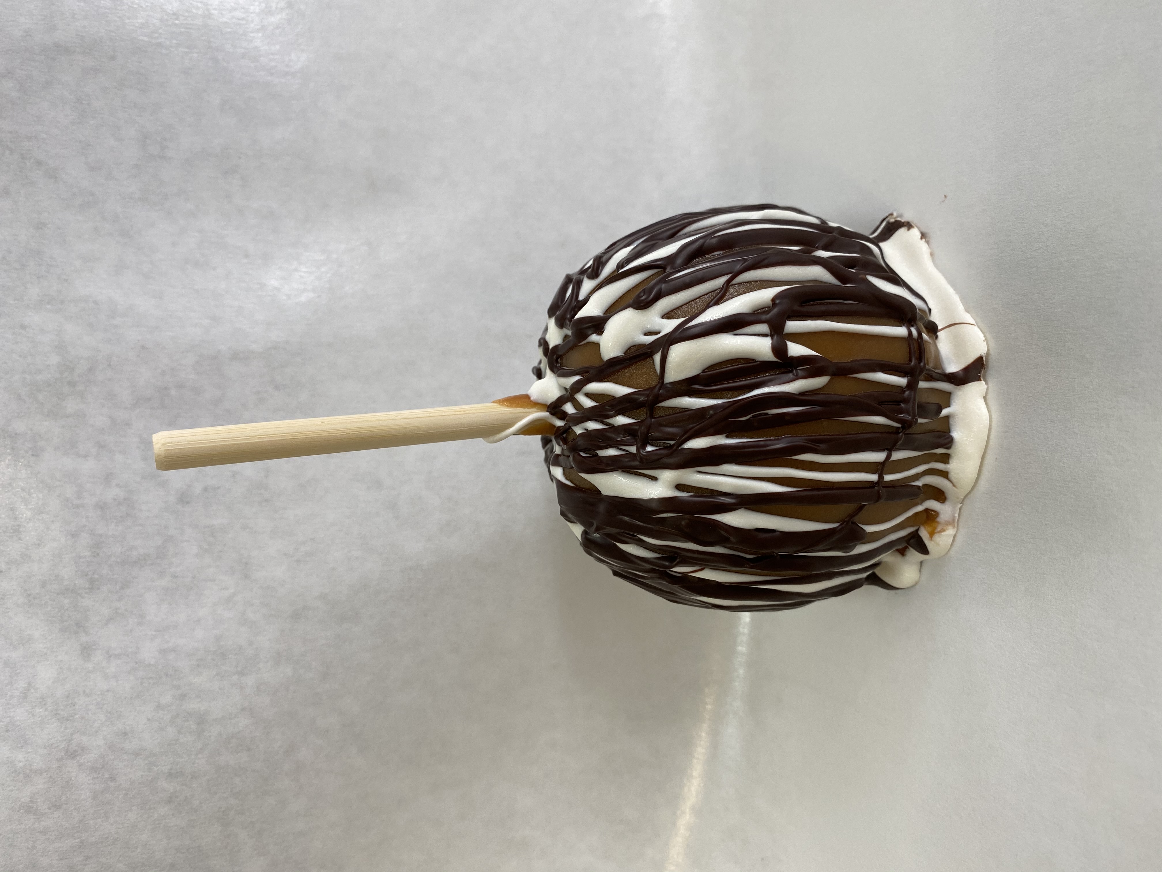 Order Zebra Caramel Apple food online from Rocky Mountain Chocolate Factory store, Irvine on bringmethat.com