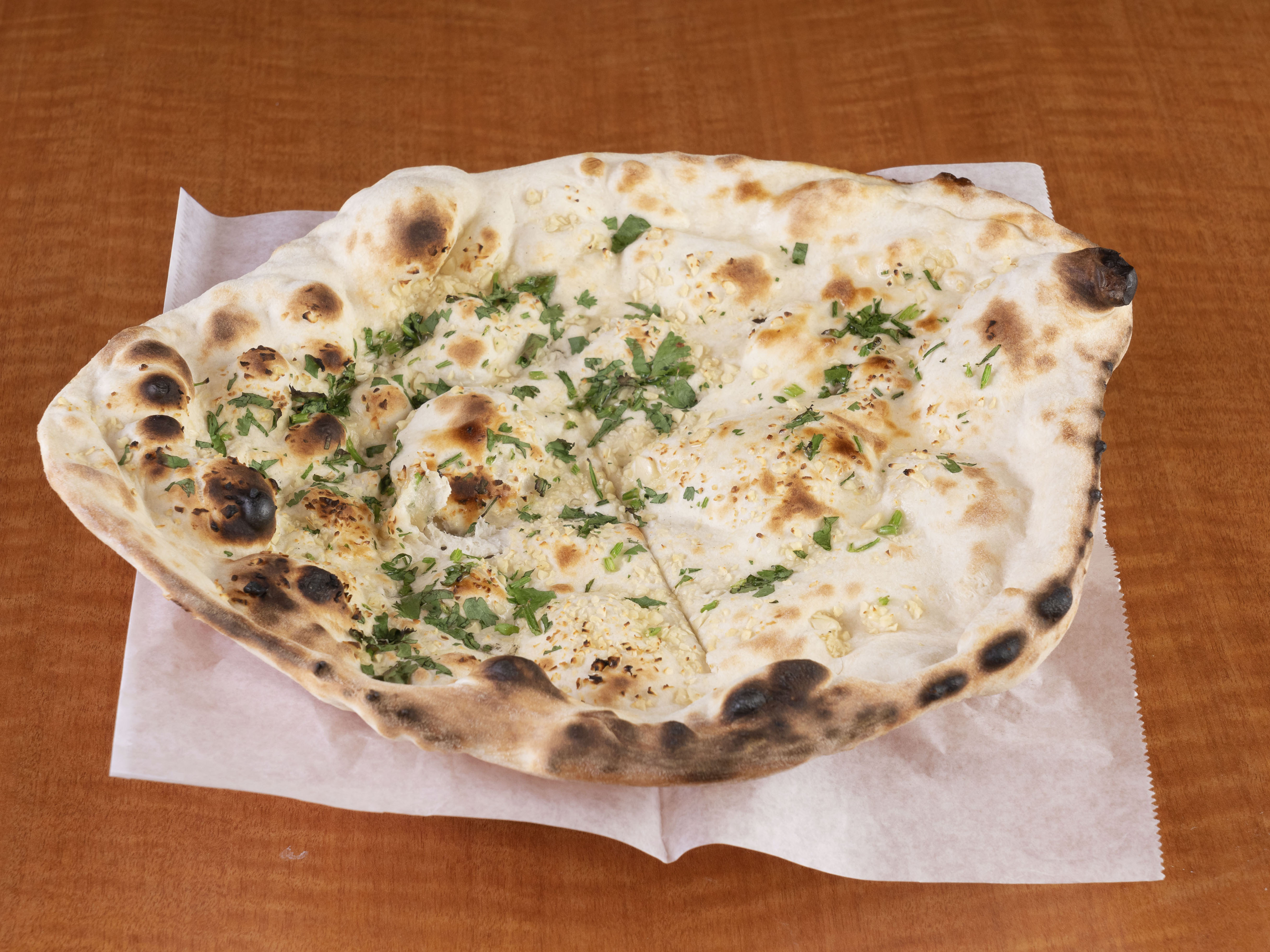 Order Garlic Naan food online from Curry Sultan store, Humble on bringmethat.com