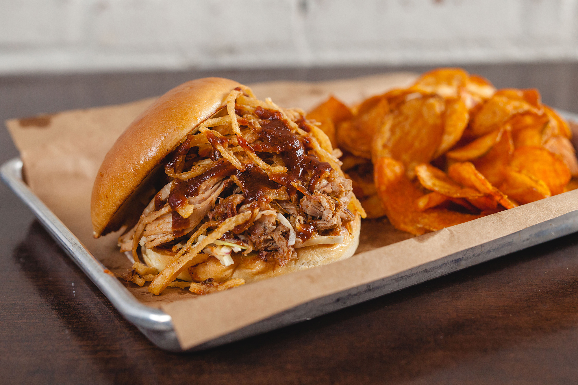 Order Pulled Pork Sandwich food online from Doc Crow Southern Smokehouse store, Louisville on bringmethat.com