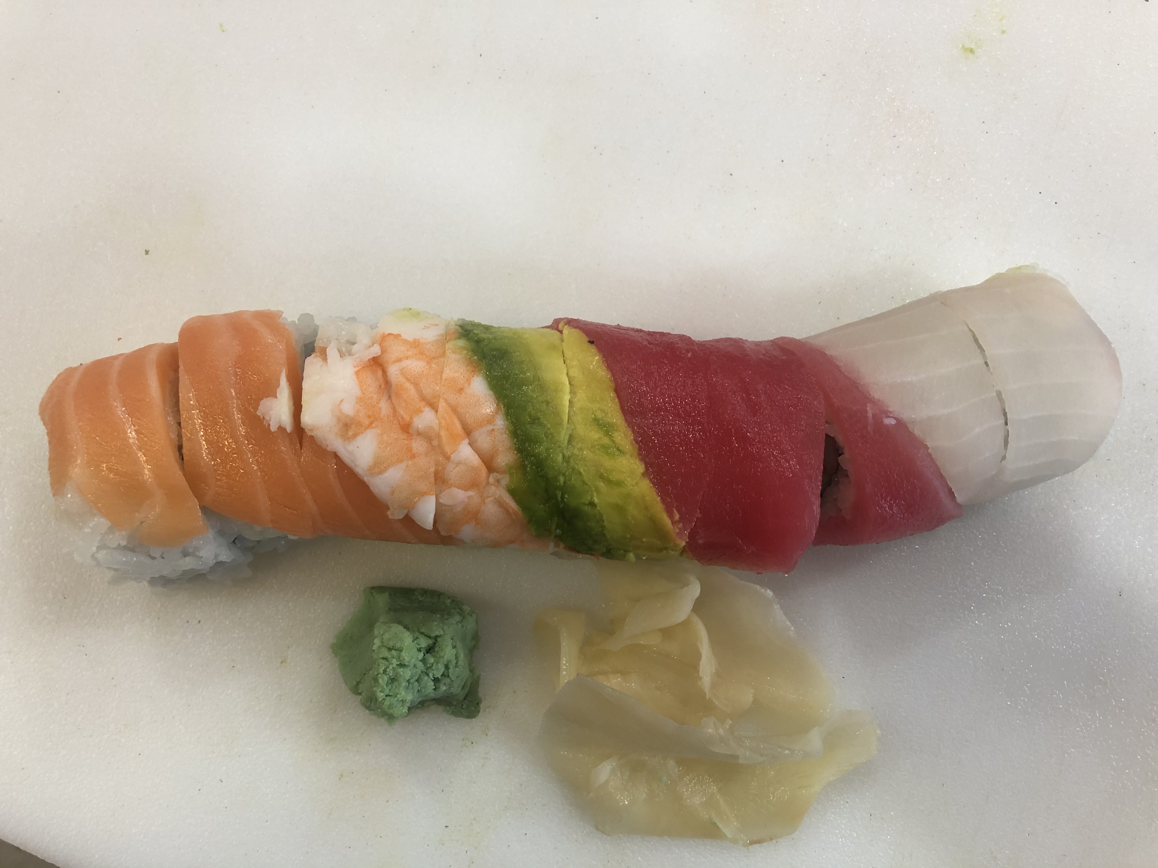 Order Rainbow Roll food online from Sushi Go store, Dallas on bringmethat.com