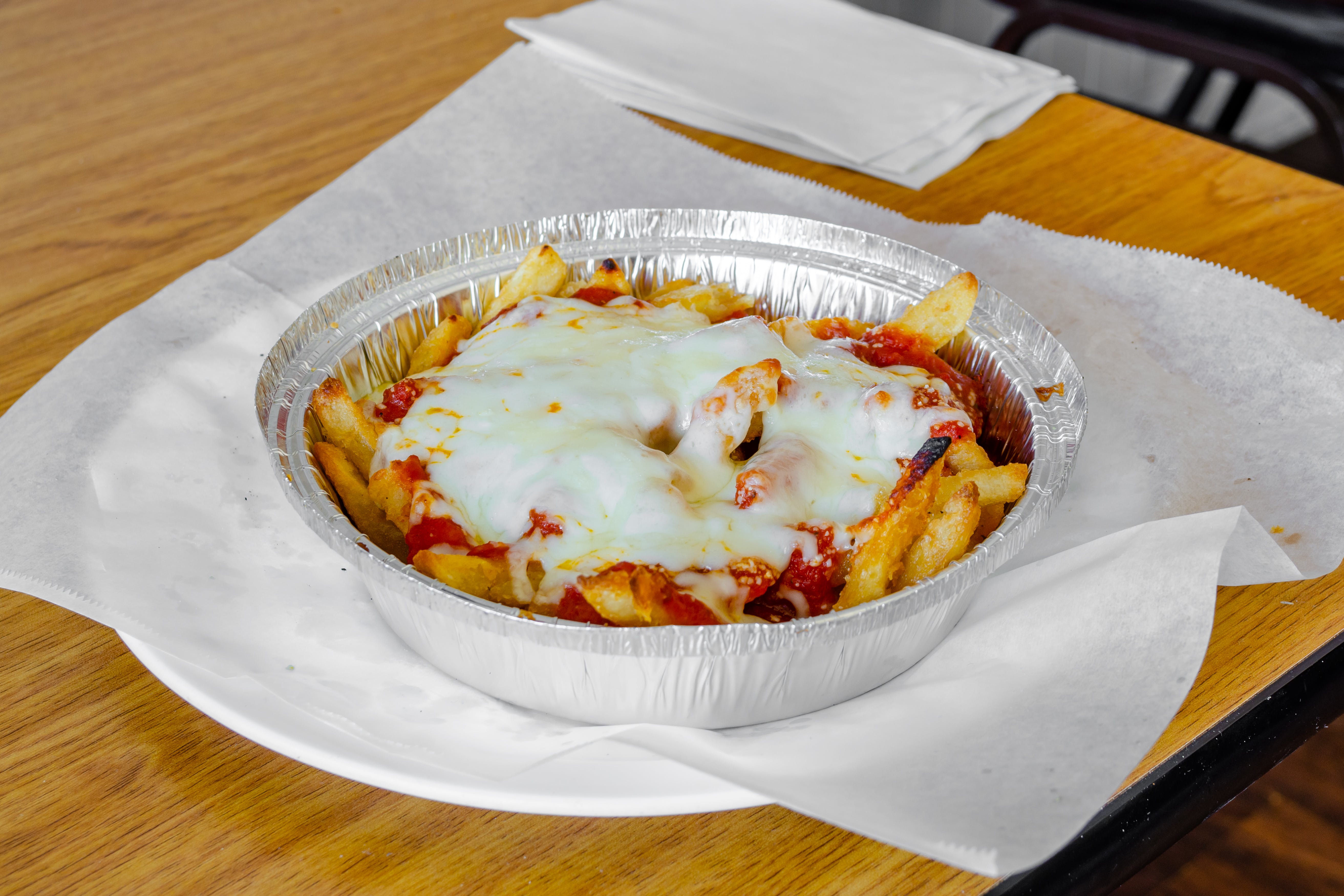 Order Pizza Fries - Side food online from Panzini Pizzeria store, Sea Isle City on bringmethat.com